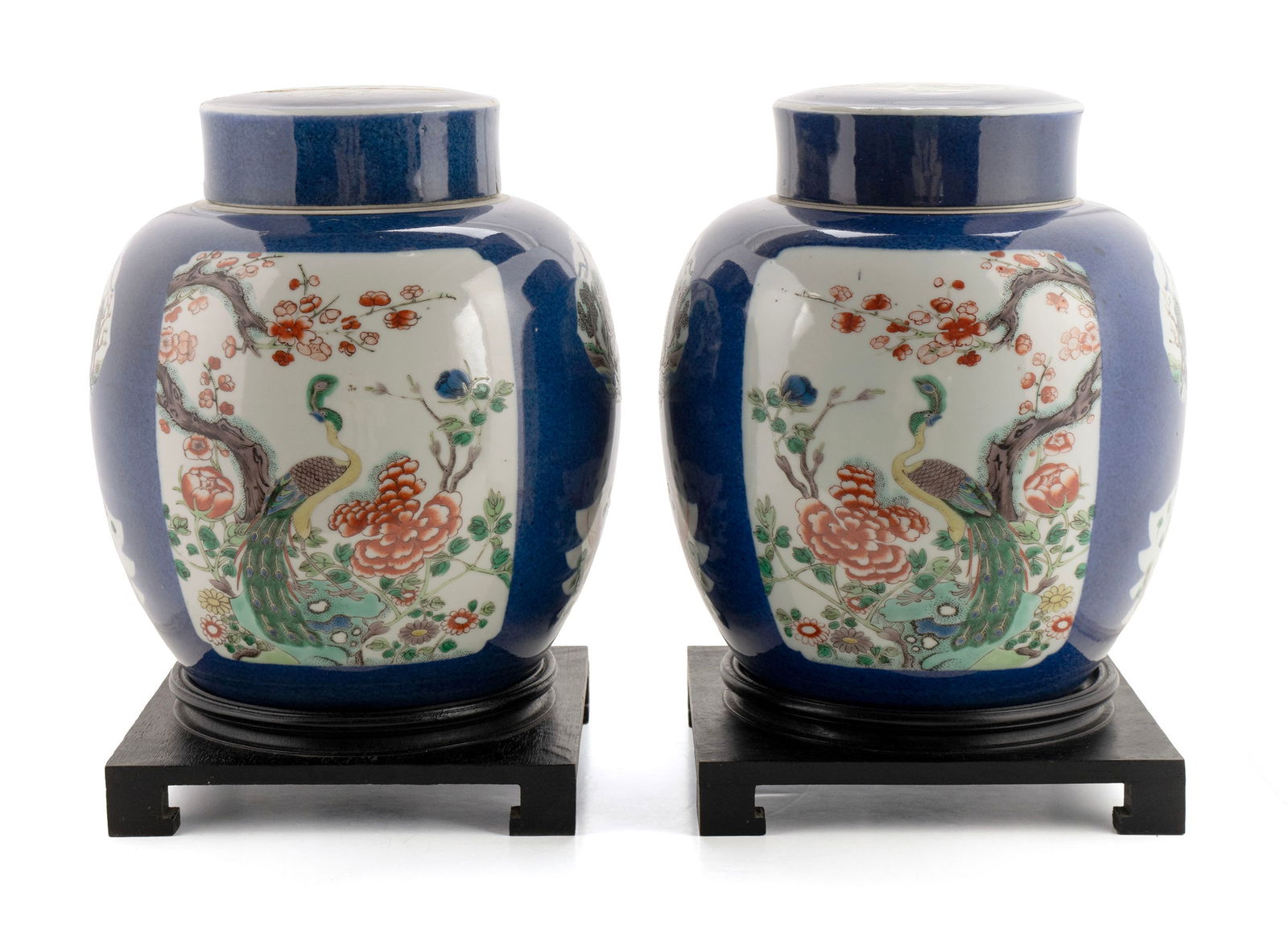 PAIR OF CHINESE EXPORT PORCELAIN GINGER JARS: PAIR OF CHINESE EXPORT PORCELAIN GINGER JARSChinese, Qing Dynasty, 19th century. Blue with famille verte panels. On stands.9 1/2 x 7 1/2 in. (24.1 x 19.1 cm.)