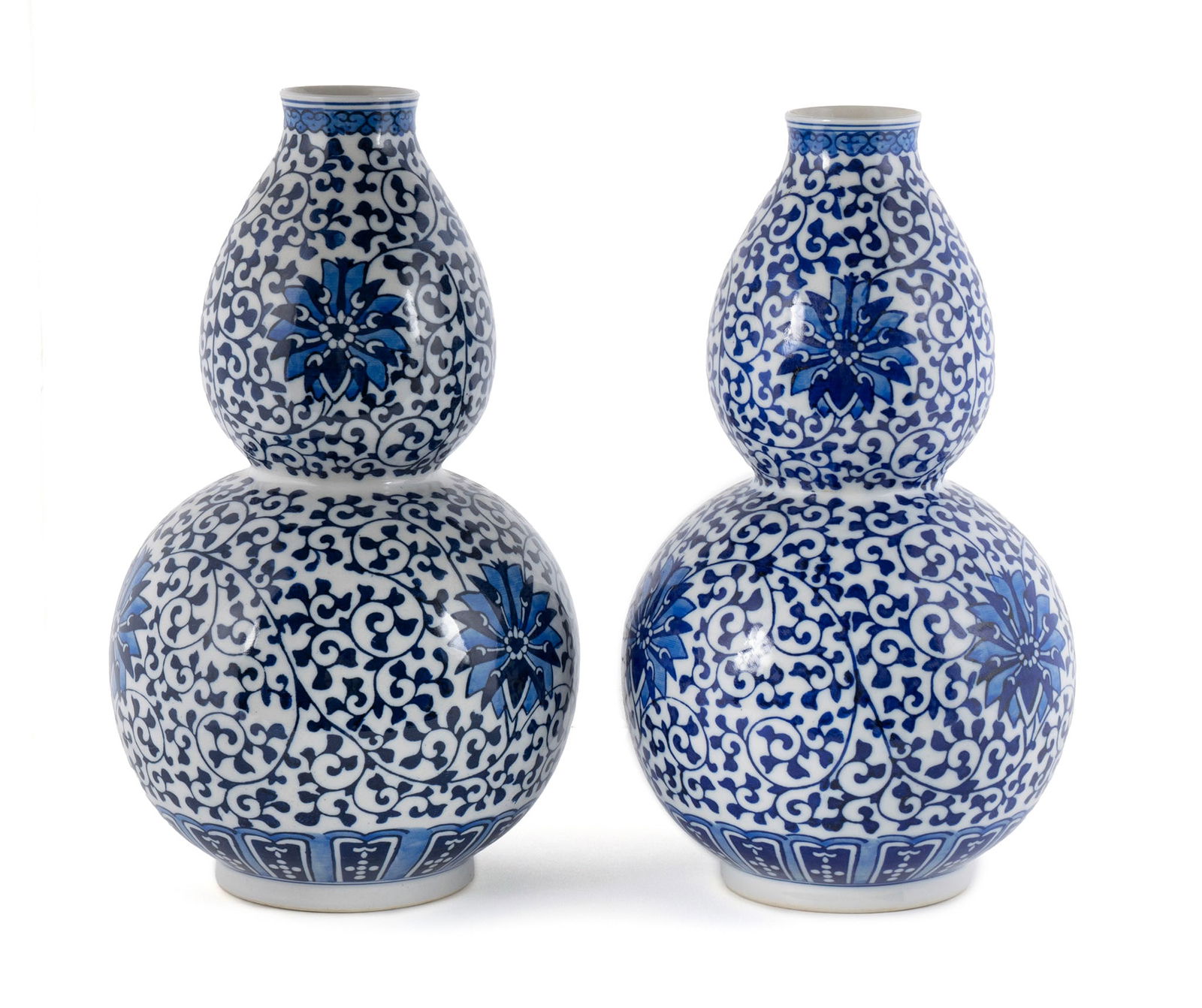 PAIR OF CHINESE PORCELAIN BLUE AND WHITE GOURD VASES: PAIR OF CHINESE PORCELAIN BLUE AND WHITE GOURD VASES20th century. Jingdezhen, character mark underfoot.11 1/2 x 6 1/4 in. (29.2 x 15.9 cm.)