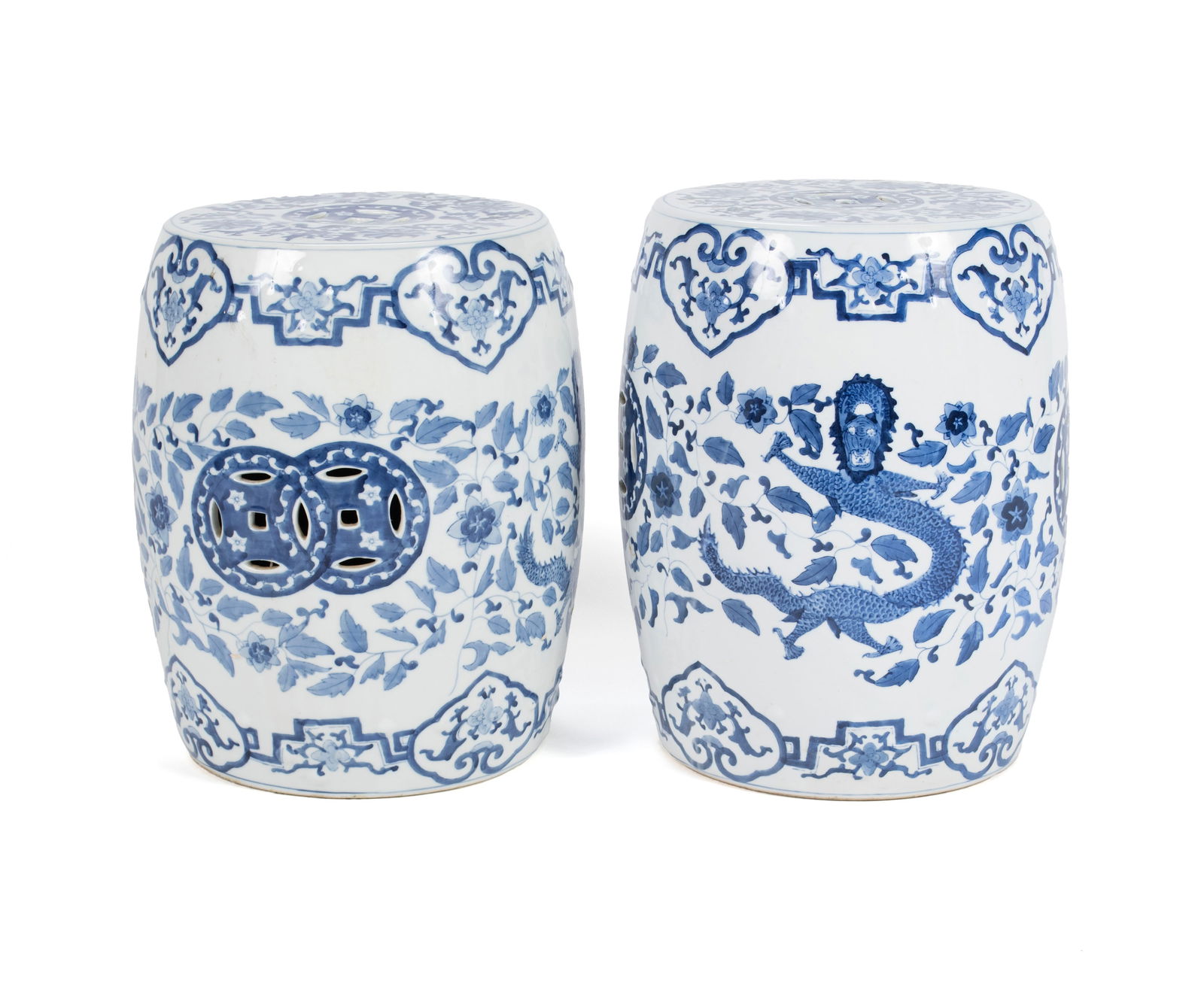 PAIR OF CHINOISERIE BLUE & WHITE GLAZED GARDEN SEATS: PAIR OF CHINOISERIE BLUE & WHITE GLAZED GARDEN SEATSChinese, 20th century, ceramic. Barrel form with pierced seats and side panels, decorated with phoenix birds to one panel and dragons to the other.1