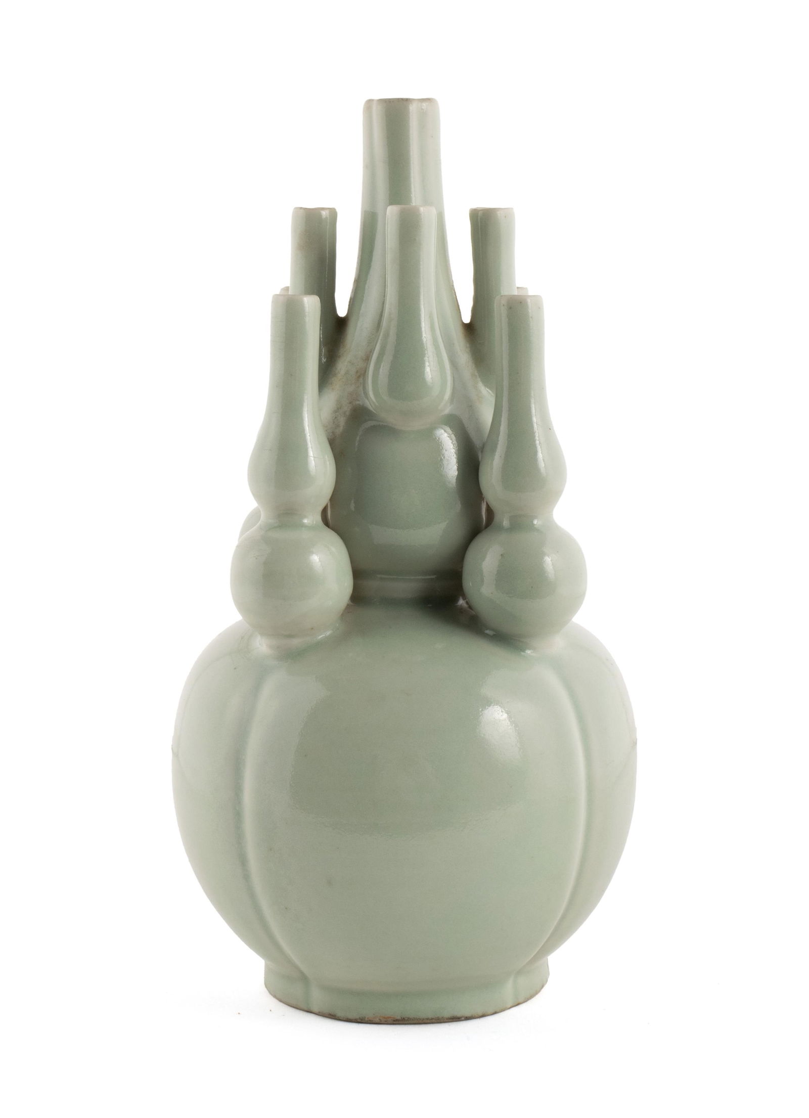 CHINESE DOUBLE-GOURD EIGHT TUBE BOTTLE VASE: CHINESE DOUBLE-GOURD EIGHT TUBE BOTTLE VASELate 19th century. Celadon porcelain bottle, unmarked.9 x 4 in. (22.9 x 10.2 cm.)