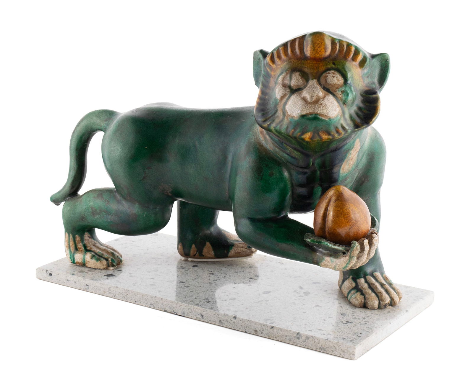VINTAGE ASIAN CERAMIC MONKEY: VINTAGE ASIAN CERAMIC MONKEY20th century. Green glaze monkey holding a peach, on a later added granite base.9 1/4 x 12 1/2 in. (23.5 x 31.8 cm.)