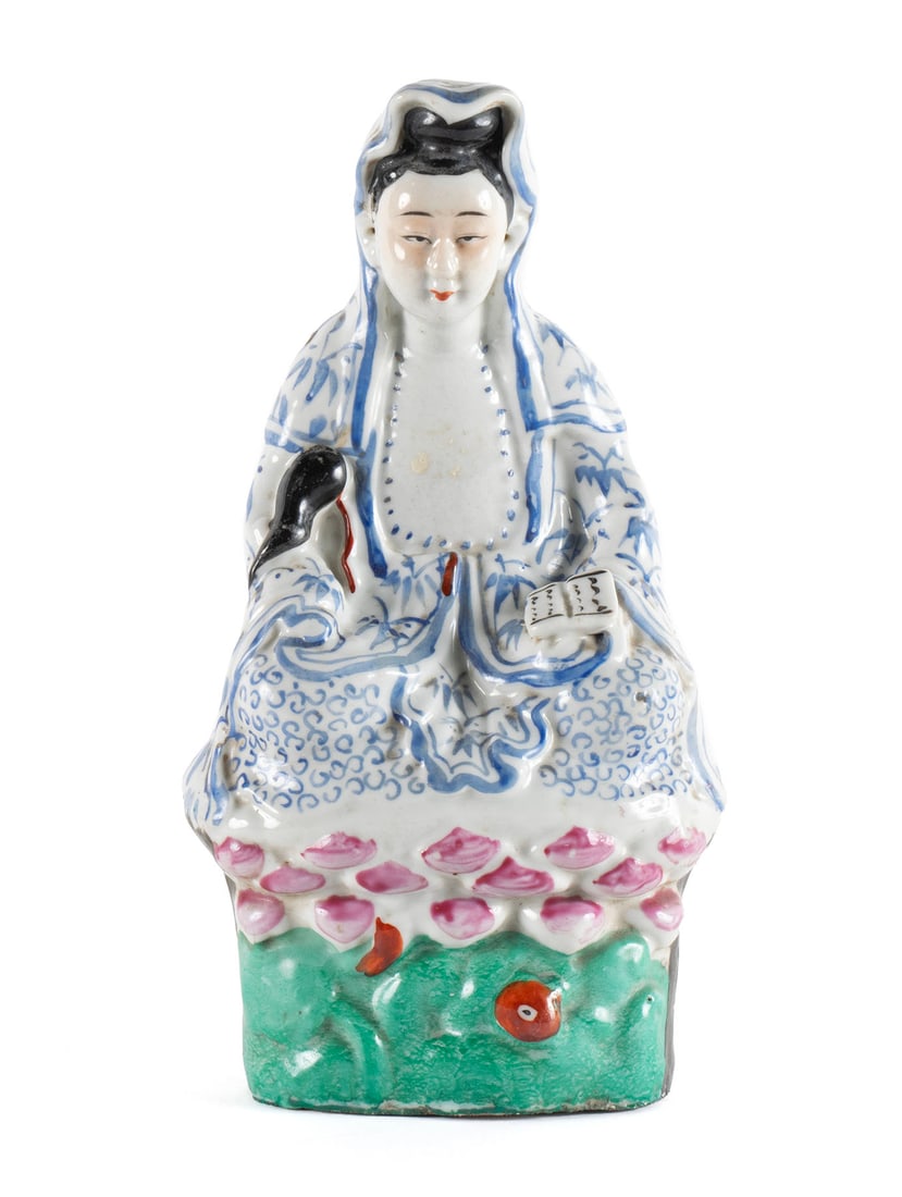 CHINESE PORCELAIN FIGURE OF A SEATED GUANYIN: CHINESE PORCELAIN FIGURE OF A SEATED GUANYINRepublic Period. Enamel decorated figure of Guanyin on Lotus throne.10 1/4 x 5 x 3 in. (26 x 12.7 x 7.6 cm.)