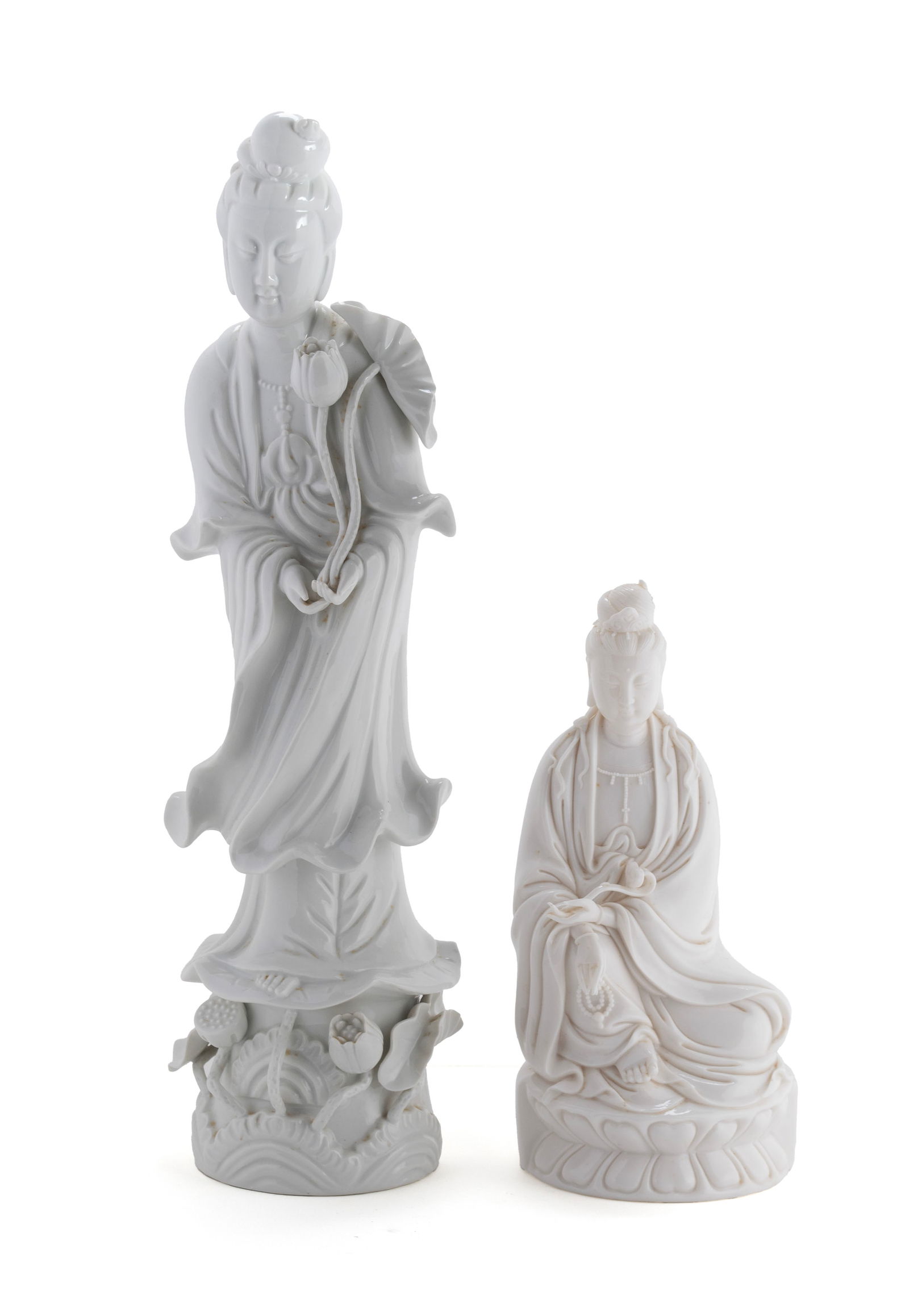 TWO 'BLANC DE CHINE' FIGURES: TWO 'BLANC DE CHINE' FIGURES20th century. One porcelain figure and one molded glass with marks to back.Larger: 20 in. (50.8 cm.), Smaller: 11 1/4 in. (28.6 cm.)