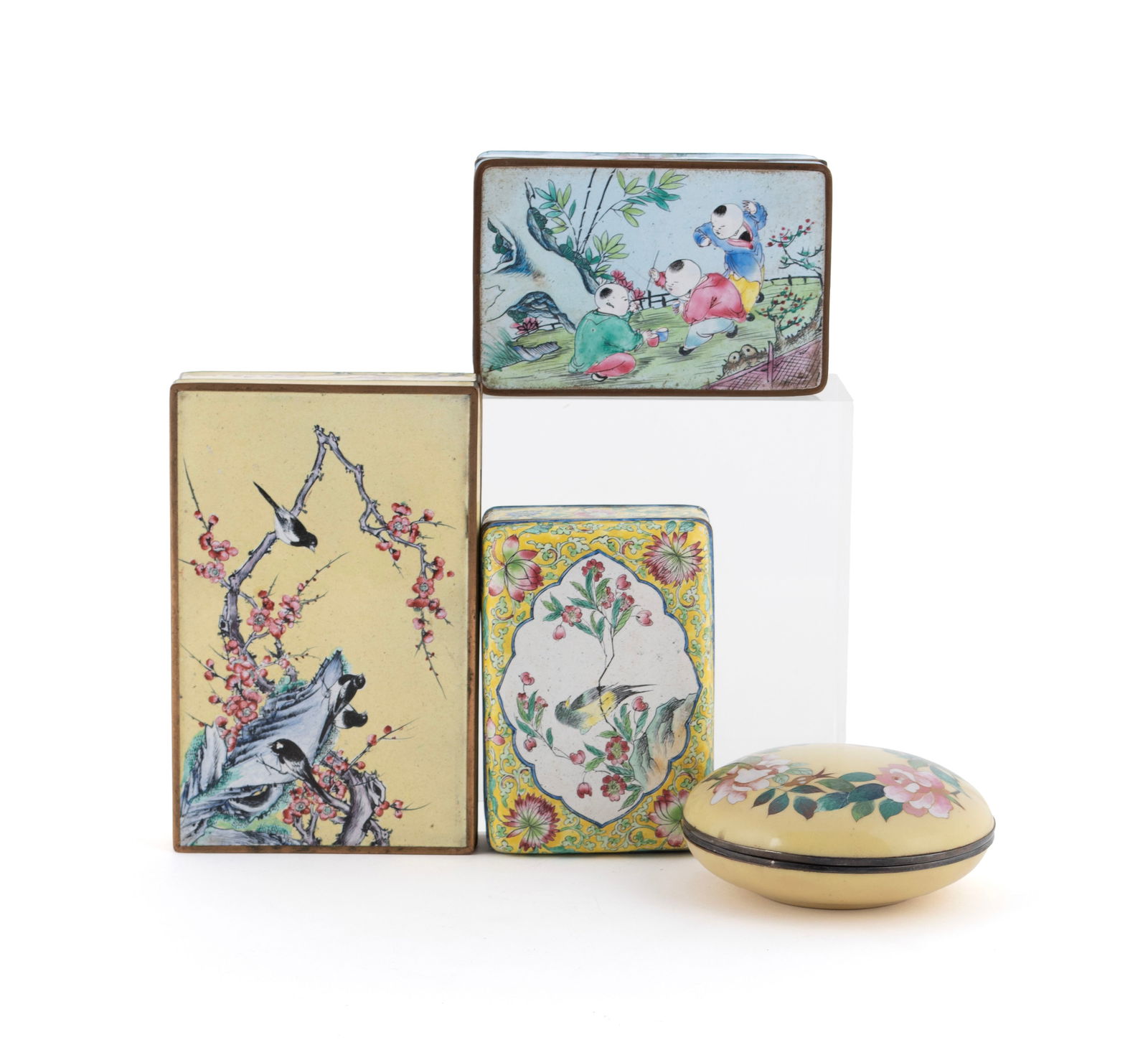 FOUR ENAMELED METAL BOXES: FOUR ENAMELED METAL BOXES20th century. Including three Chinese examples and a round Continental box.Largest: 1 1/8 x 6 3/8 x 4 in. (2.9 x 16.2 x 10.2 cm.)