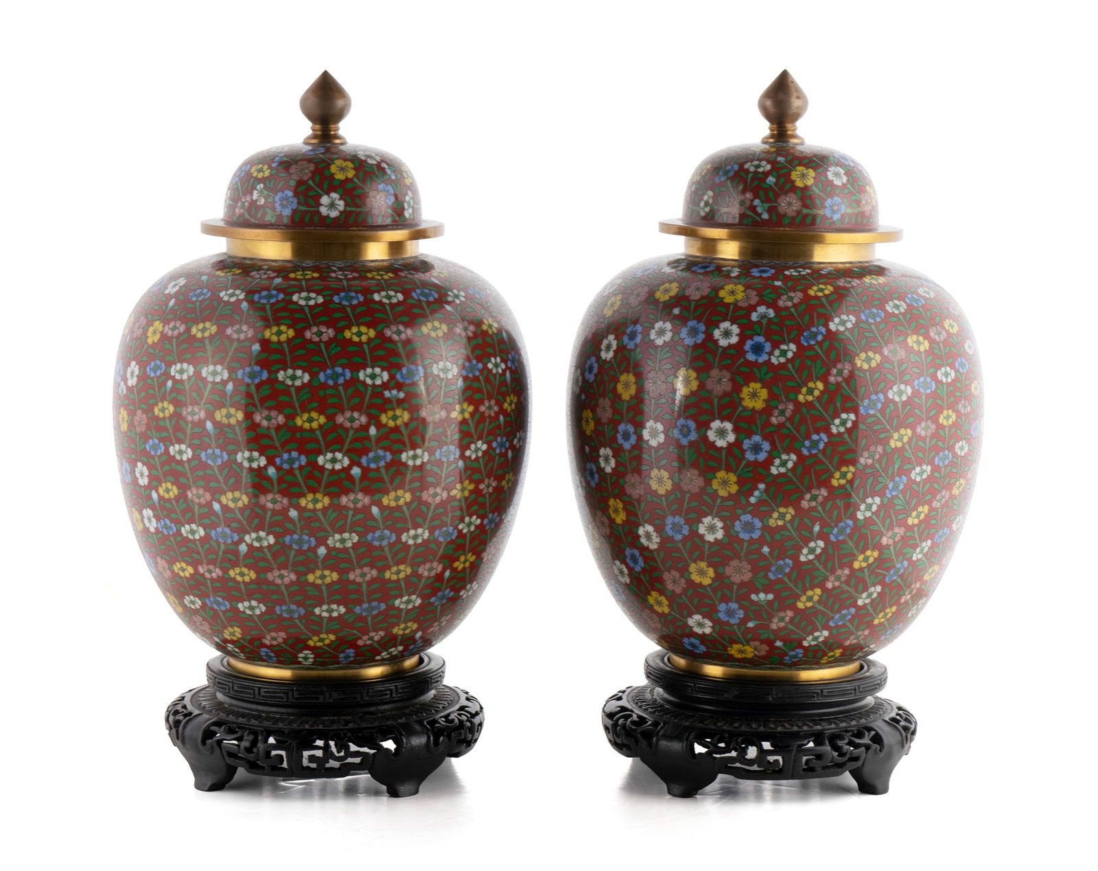 PAIR OF COVERED CLOISONNE GINGER JARS: PAIR OF COVERED CLOISONNE GINGER JARSChinese, 20th century. Allover colorful floral design on the red ground.9 3/4 in. (24.8 cm.)