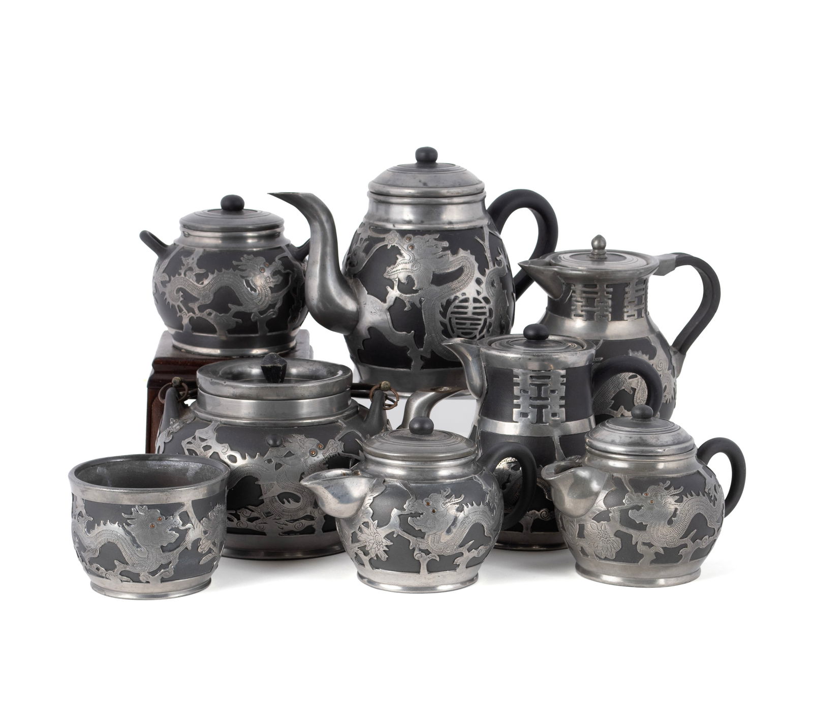 CHINESE PEWTER AND YIXING TEA SET: CHINESE PEWTER AND YIXING TEA SET 20th century. Eight-piece Yixing stoneware tea set with pewter dragon overlay, all marked on underside. Largest: 6 1/4 in. (15.9 cm.)