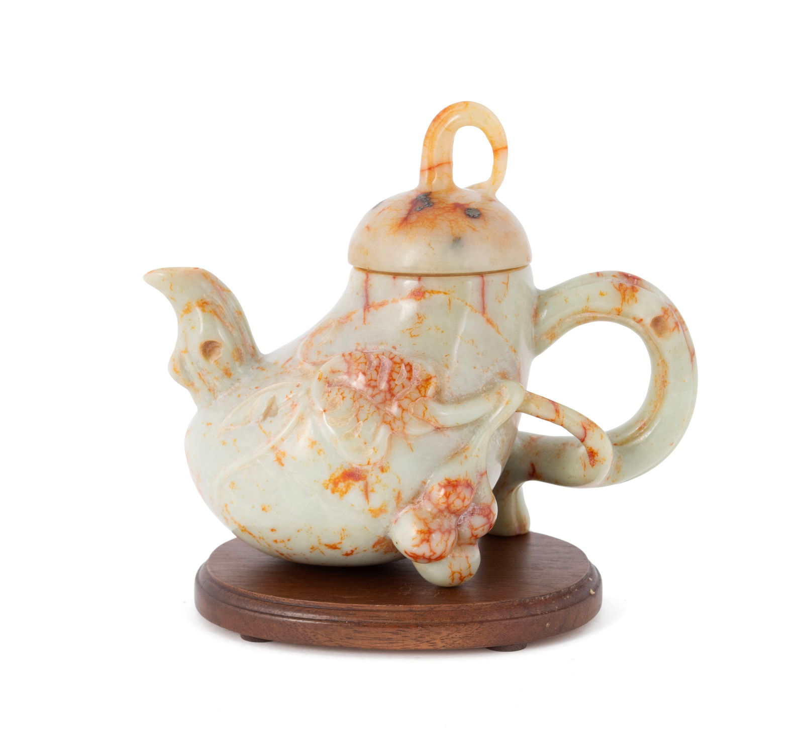 CHINESE JADEITE TEAPOT: CHINESE JADEITE TEAPOT 20th Century. Melon-form teapot with leaf and berry decoration. 5 1/4 x 6 x 3 1/2 in. (13.3 x 15.2 x 8.9 cm.)
