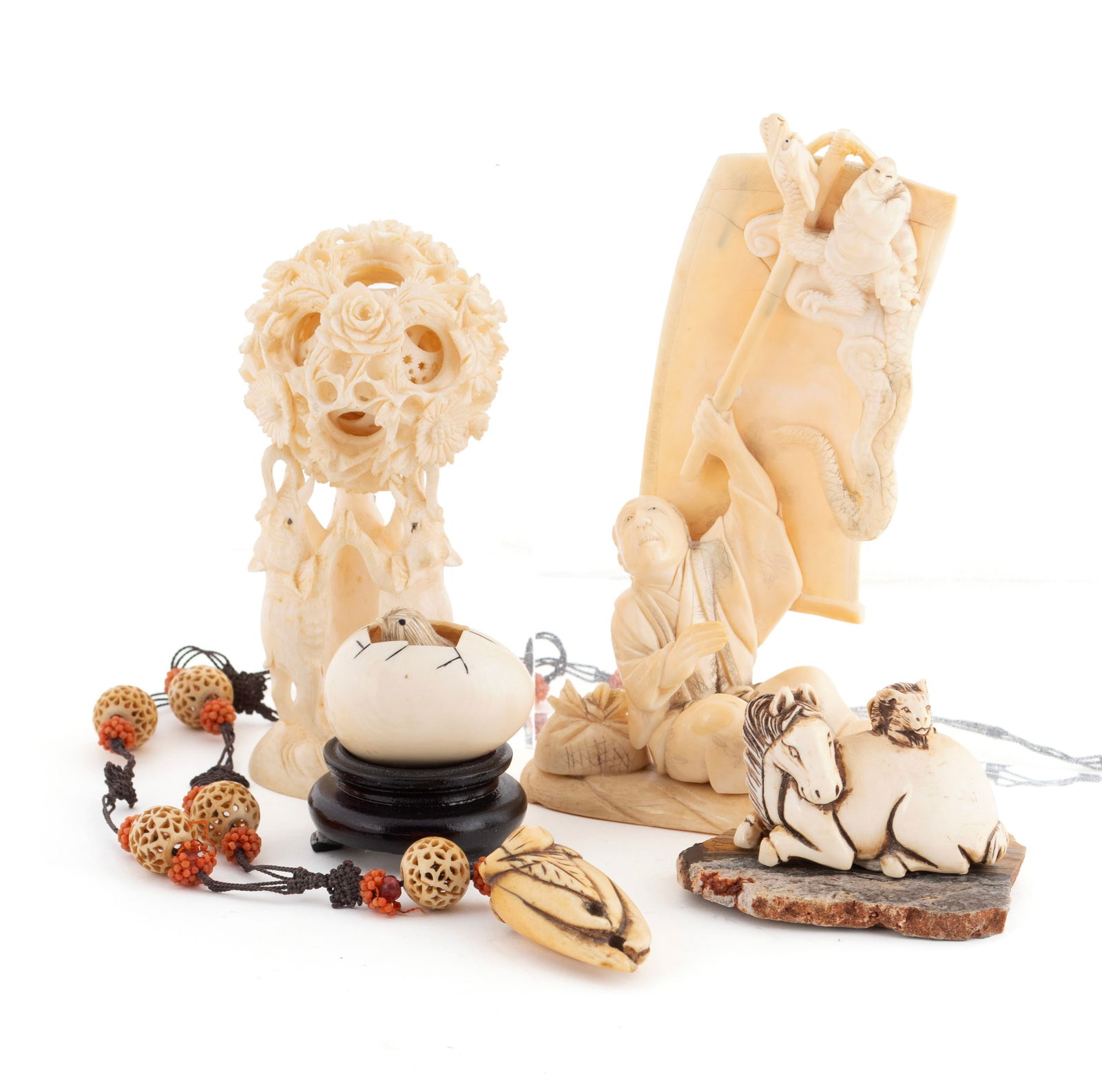 CARVED NETSUKE AND OTHER COLLECTIBLES: CARVED NETSUKE AND OTHER COLLECTIBLESJapanese, 19th/20th century. Three (3) netsukes: one seated horse with rabbit atop its back, one a chick and egg, and one strung as a pendant on a string of carved