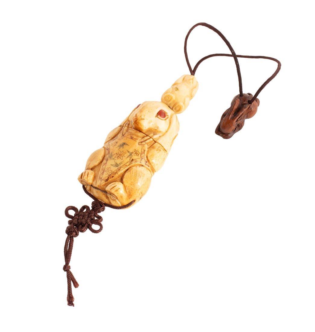 JAPANESE CARVED RABBIT-FORM INRO: JAPANESE CARVED RABBIT-FORM INRO Late Meiji. Polychrome decorated carved figural single compartment inro with two rabbit-form toggles. 2 3/4 in. (7 cm.)