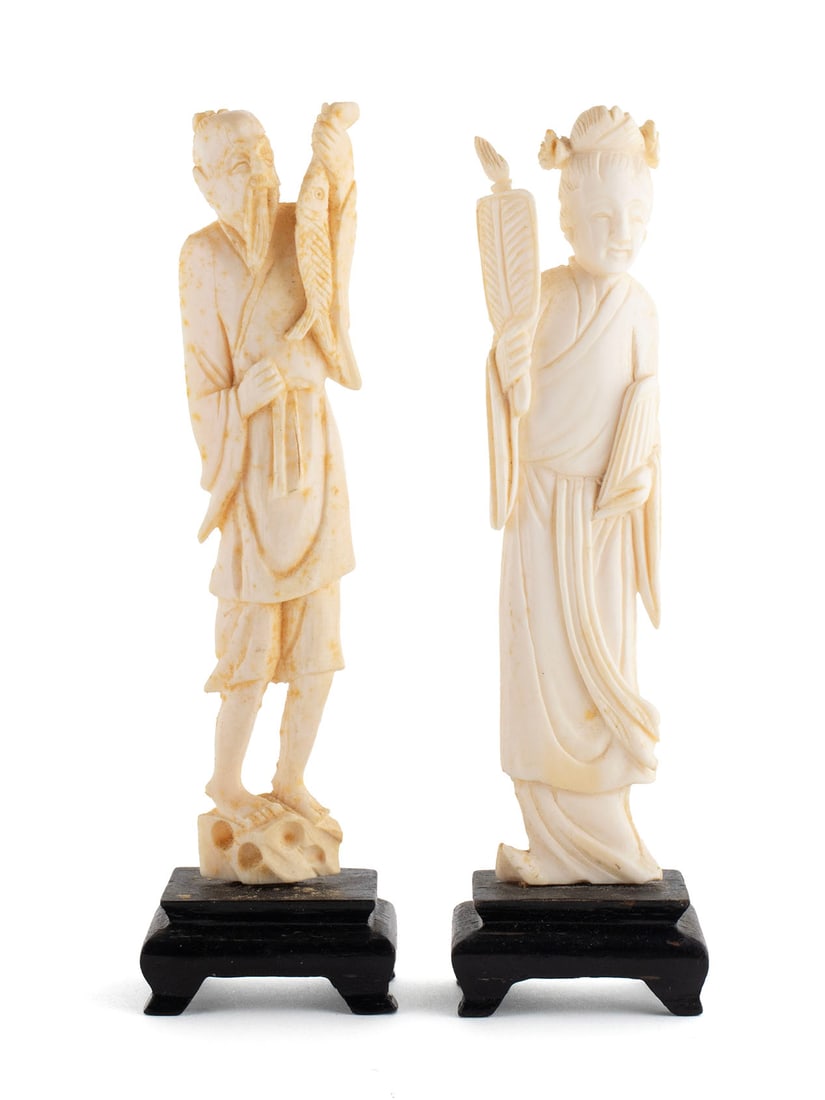 TWO DIMINUTIVE ASIAN CARVED FIGURES: TWO DIMINUTIVE ASIAN CARVED FIGURESEarly 20th century. Japanese carved okimono of a woman with fan together with a Chinese figure of a fisherman.Woman: 5 in. (12.7 cm.)