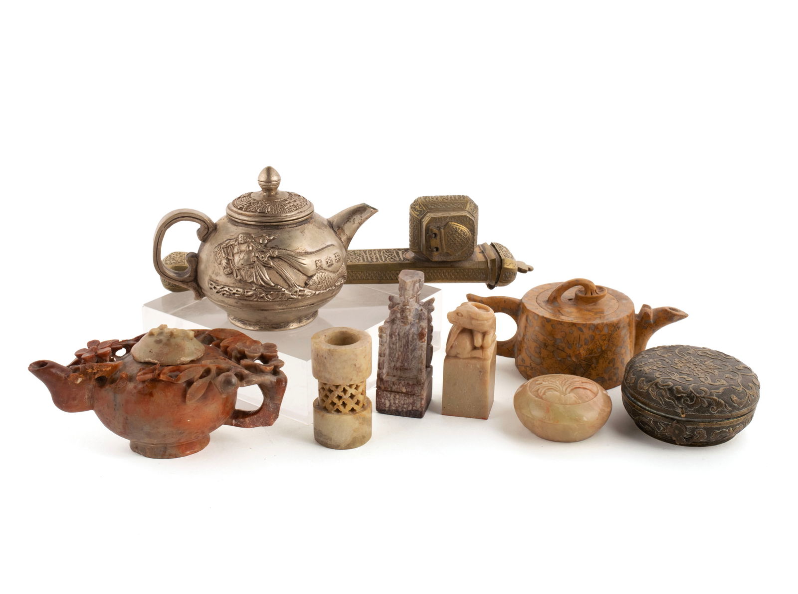 EIGHT PIECES OF ASIAN DECORATIVE ART: EIGHT PIECES OF ASIAN DECORATIVE ART20th century. Including a Chinese silvered metal "Buddha" teapot, Chinese mixed-metal round vanity box, Persian style brass "divit/qalamdan" scribes' case, two dimi
