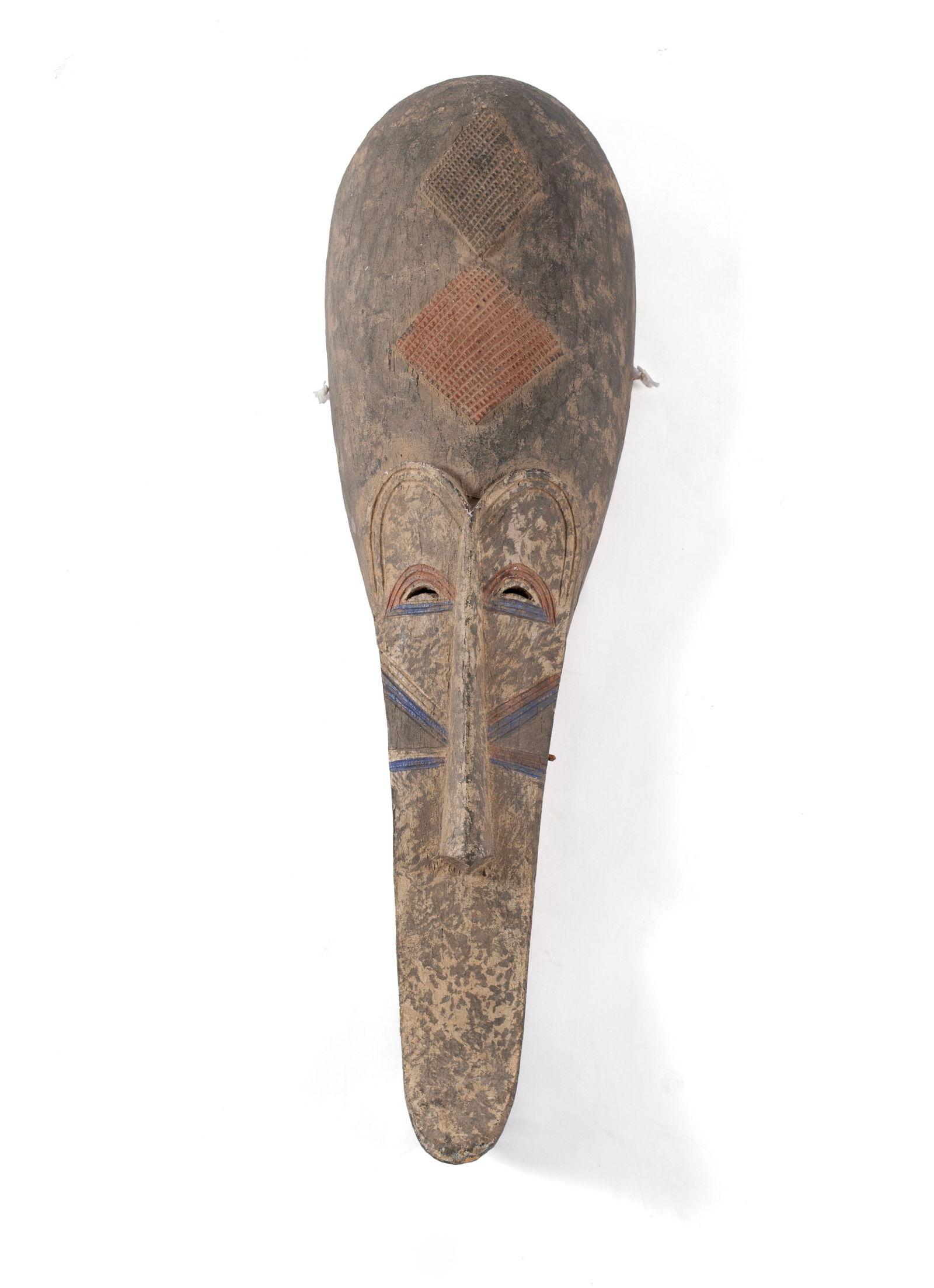 FANG NGIL STYLE MASK: FANG NGIL STYLE MASKCameroon, circa 1970. Polychrome decorated elongated Ngil Society style mask.36 1/2 x 10 1/2 x 5 in. (92.7 x 26.7 x 12.7 cm.) Collection of Northland College, Ashland, WI