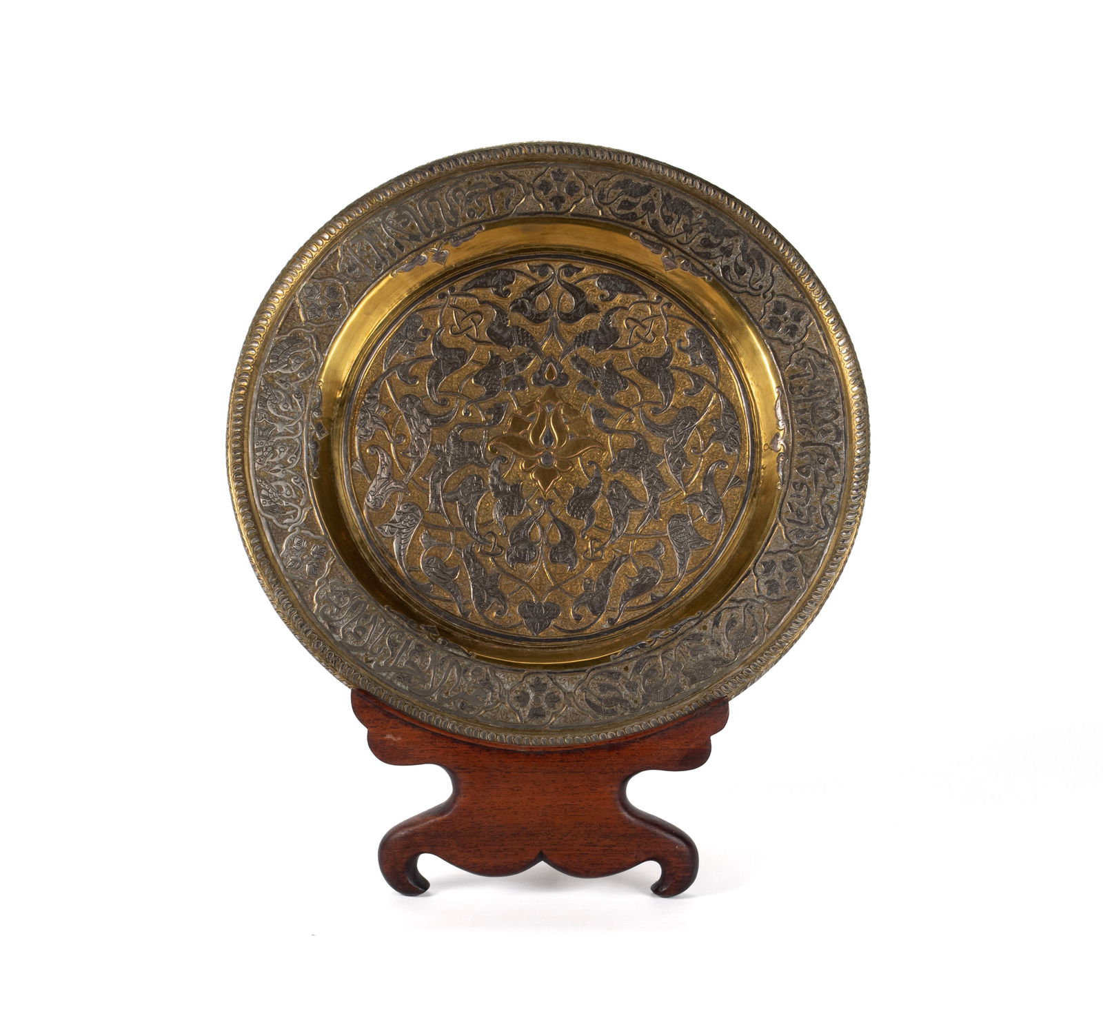 MIXED-METAL CAIRO WARE CALLIGRAPHIC TRAY: MIXED-METAL CAIRO WARE CALLIGRAPHIC TRAYLate 19th/early 20th century, gold and silver inlaid brass circular tray. Central gold motif surrounded by scrolling bird decoration, the rim with scrolling bir