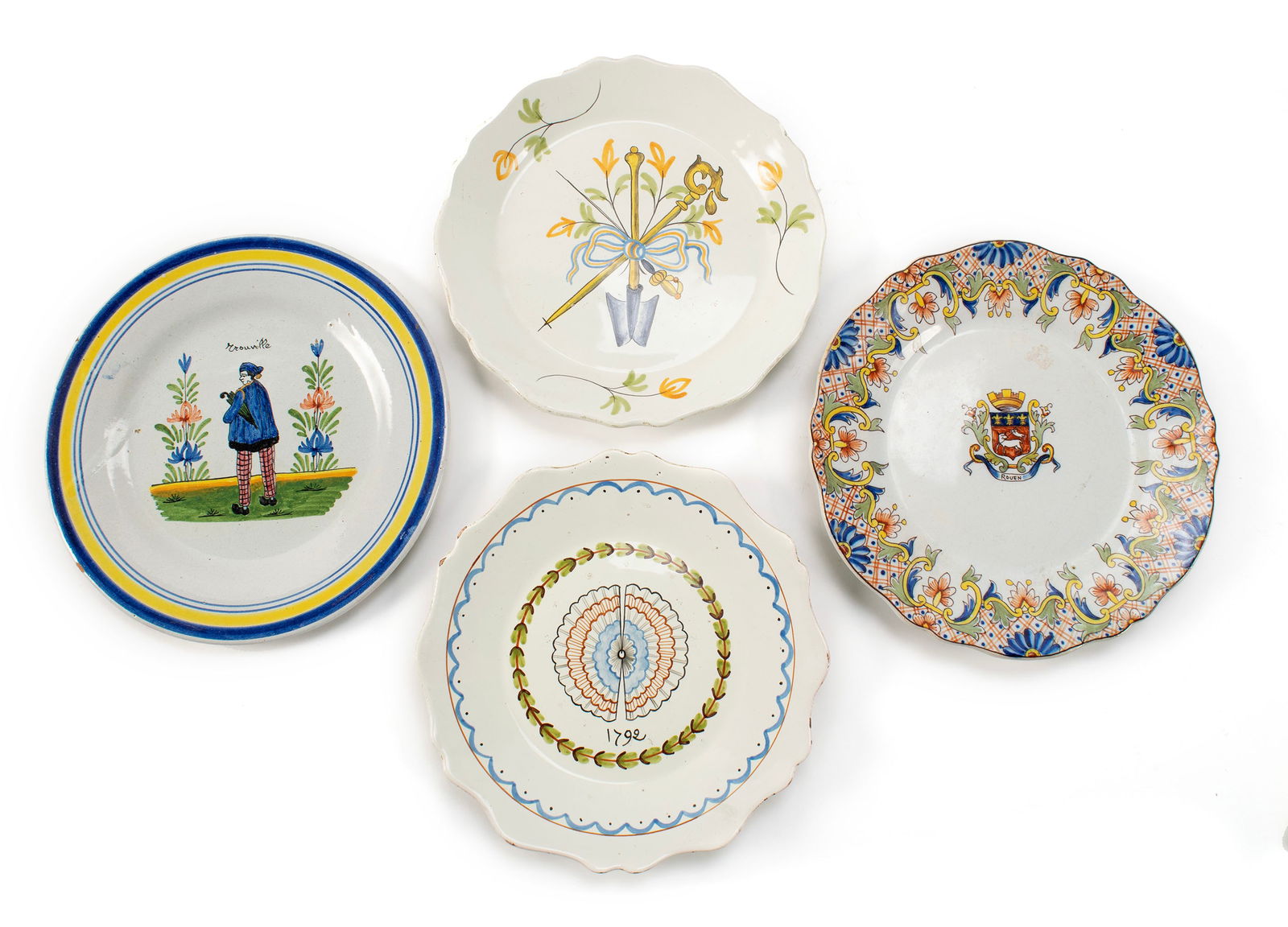 FOUR FRENCH FAIENCE PLATES: FOUR FRENCH FAIENCE PLATES Continental, 19th century. Including Rouen and Quimper. Largest: 9 3/4 in. (24.8 cm.)