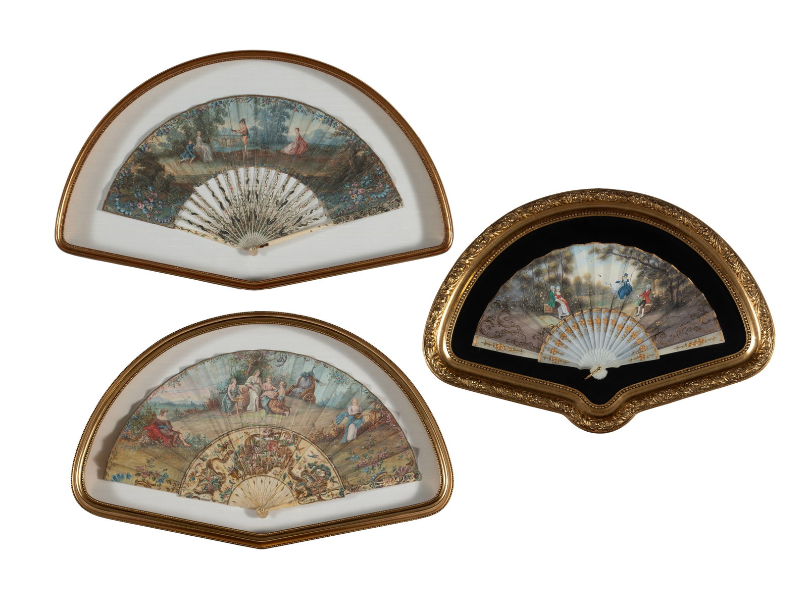 THREE HAND PAINTED FANS: THREE HAND PAINTED FANS Continental, early 20th century. Finely detailed painted with genre scenes, each mounted and displayed open, within gilt framed shadow boxes. Largest: 15 1/2 x 25 1/2 in.