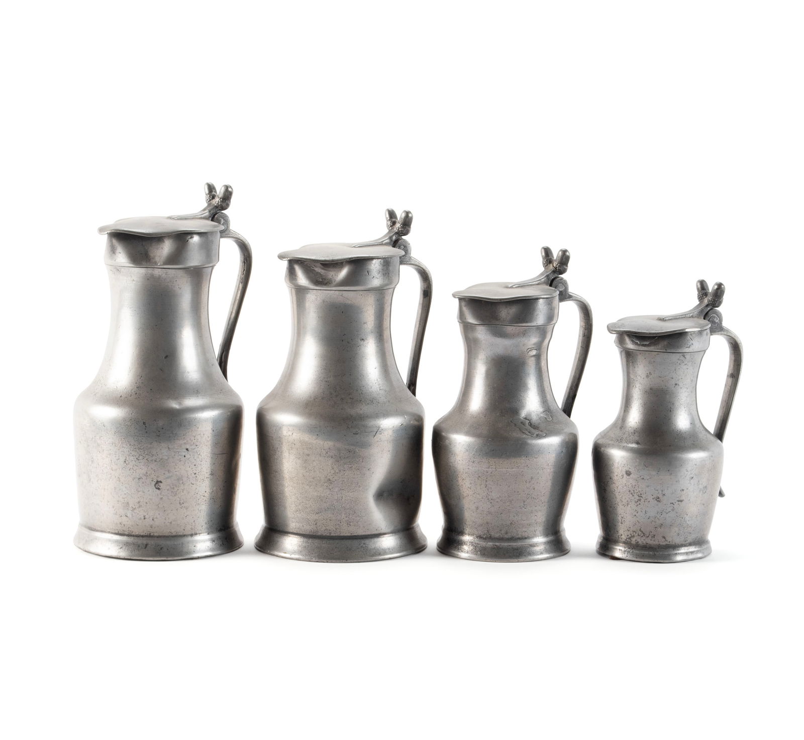 SET OF FOUR LARGE FRENCH GRADUATED PEWTER MEASURES: SET OF FOUR LARGE FRENCH GRADUATED PEWTER MEASURESContinental, 18th/19th century, the two larger showing double stamped crowned rose touchmarks, the two smaller showing double stamped fluer de lis tou