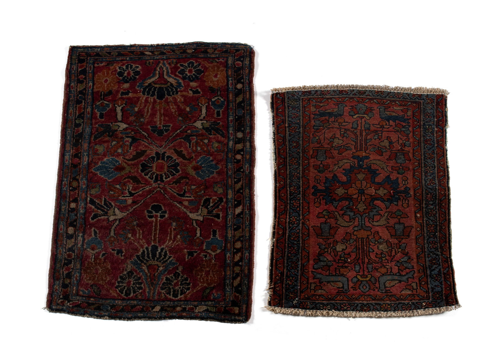 TWO SAROUK THROW RUGS: TWO SAROUK THROW RUGSPersian, early 20th century. Both with floral designs on the red fields, the larger rug with navy border and blue guard borders, the small with blue border and red guard borders.3