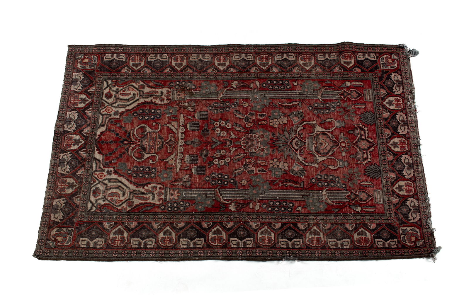 DIRECTIONAL AREA RUG: DIRECTIONAL AREA RUGPersian, mid-20th century. Red field is decorated with a flowering urn and chandelier above flanked by vertical columns emitting ivory highlights at the top, colorful geometric and