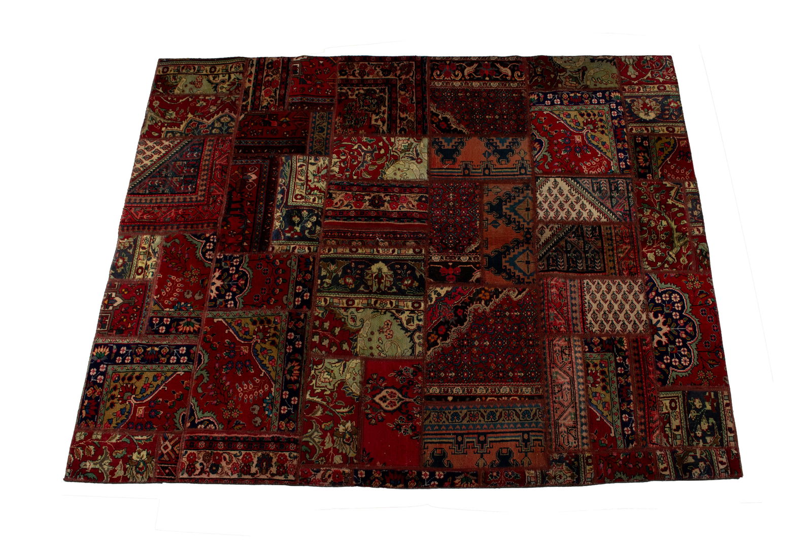 PERSIAN PATCHWORK HALL RUG: PERSIAN PATCHWORK HALL RUGPersian, 20th century. An assortment of clean and straight rectangular fragments creates the unique floral and geometric designs throughout.9 ft. x 6 ft. 9 in.