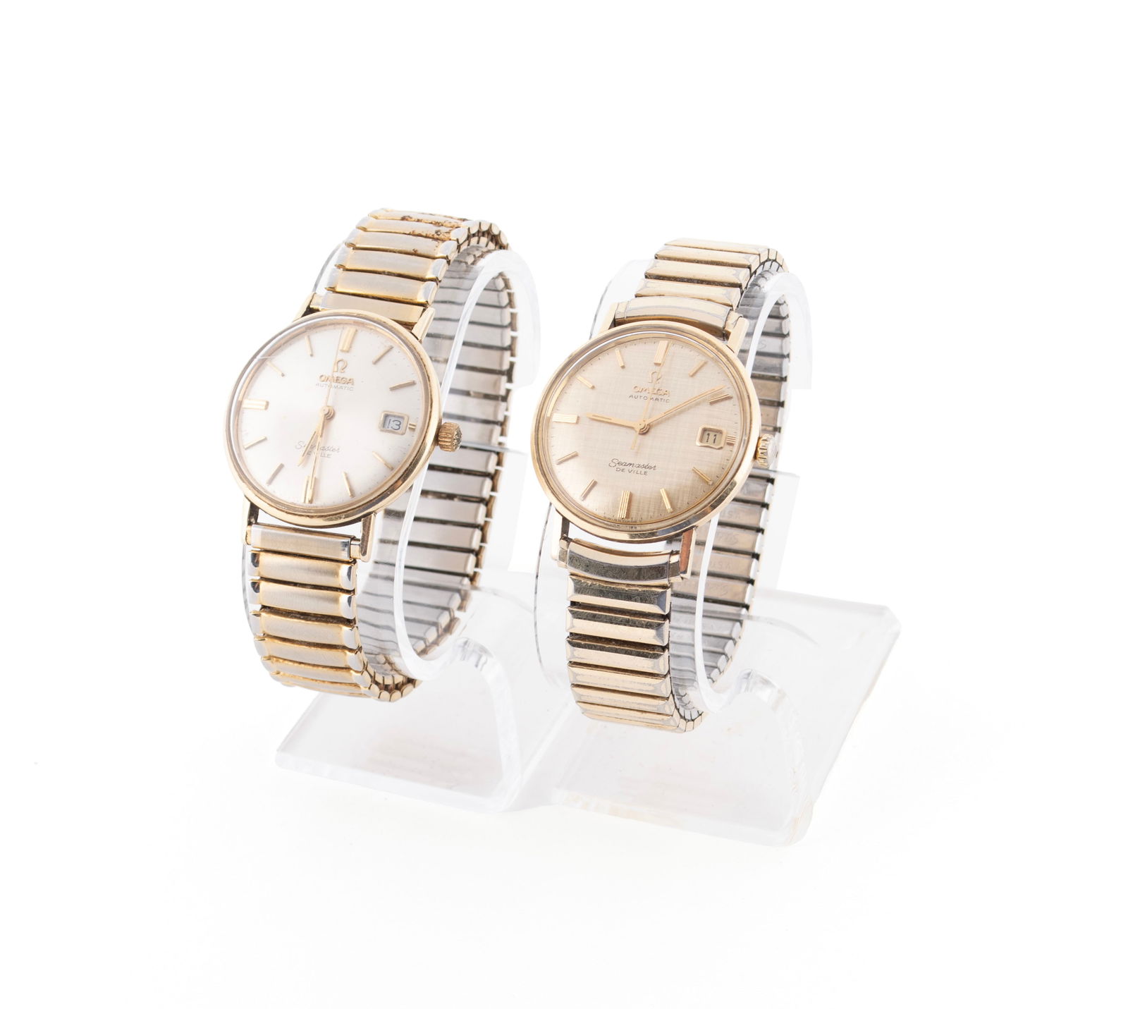 TWO VINTAGE MENS OMEGA SEAMASTER DE VILLE WATCHES: TWO VINTAGE MENS OMEGA SEAMASTER DE VILLE WATCHESSwiss-made, automatic, 34mm diameter. One with pearl dial, and one with brushed gold. Both with expandable bracelets.