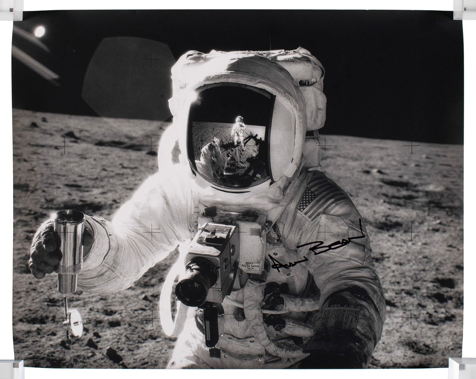 ASTRONAUT ALAN BEAN SIGNED APOLLO 12 PHOTOGRAPH: ASTRONAUT ALAN BEAN SIGNED APOLLO 12 PHOTOGRAPHSigned in black marker below the American flag on his left sleeve, unframed.16 x 20 in. (40.6 x 50.8 cm.)