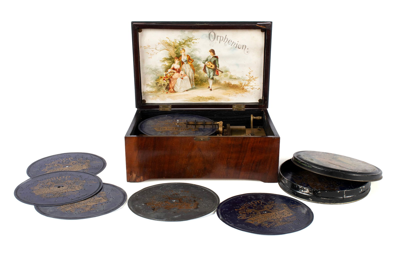 ORPHENION DISC MUSIC BOX: ORPHENION DISC MUSIC BOXGerman, circa 1900. Tabletop box playing ten 7-inch Orphenion discs on a single comb, "Orphenion" color advertising image to the interior of the lid.5 1/4 x 13.19 x 8.69 in. (1