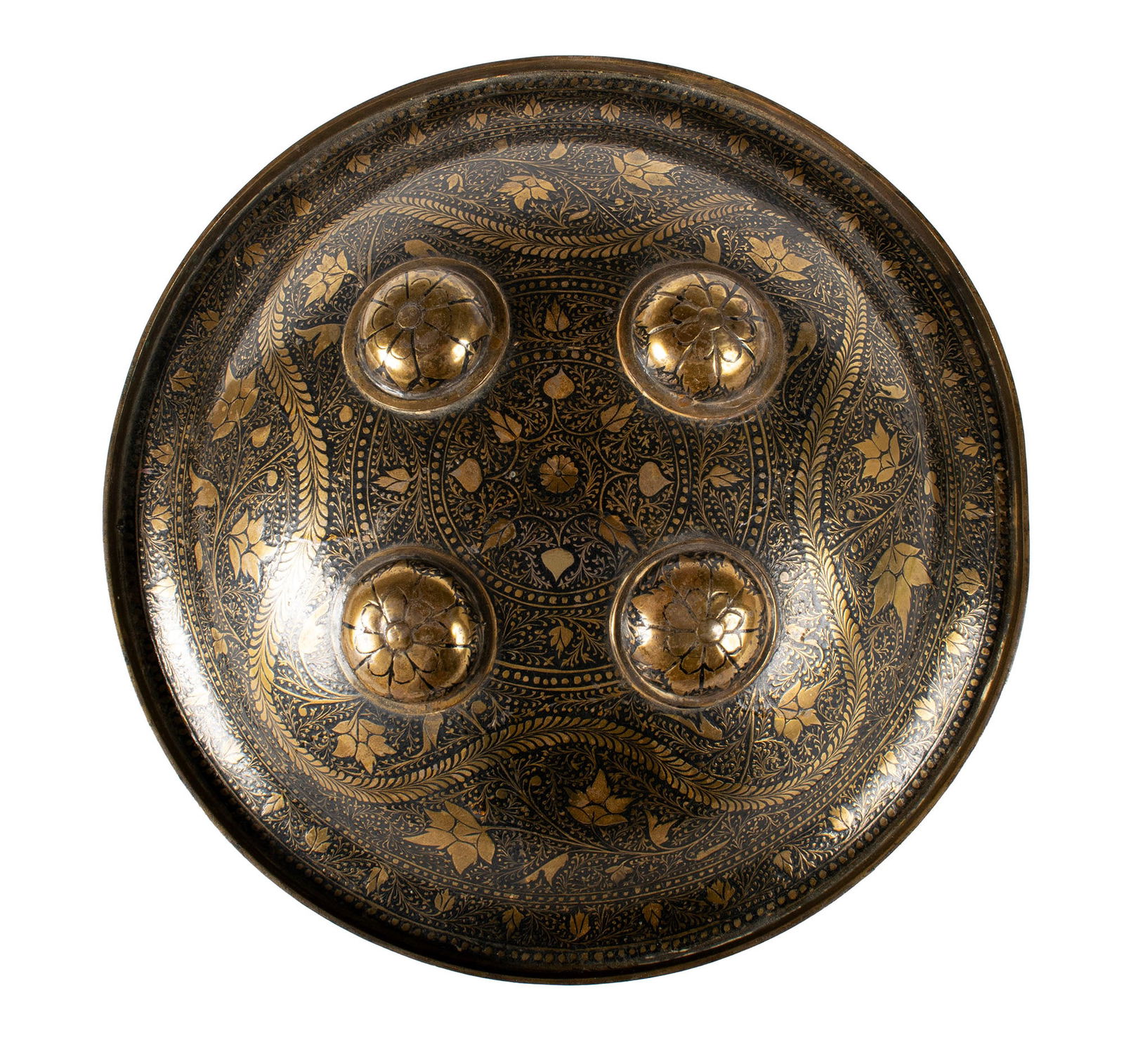 INDO-PERSIAN DHAL SHIELD: INDO-PERSIAN DHAL SHIELDIndian, 19th century. Black enameled foliate decorated brass buckler shield having four bosses with original cushioned grip pad.Diameter: 10 3/4 in. (27.3 cm.)