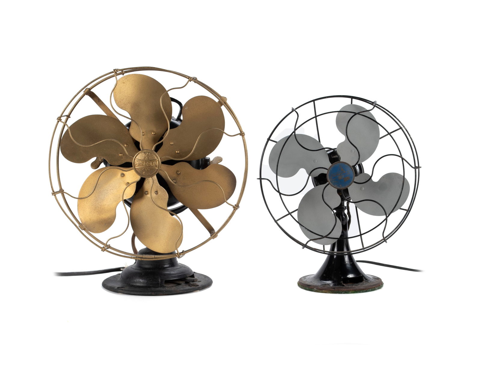 TWO EARLY EMERSON ELECTRIC FANS: TWO EARLY EMERSON ELECTRIC FANS American, early 20th century. One a six-bladed fan with brass blades and cage. Together with a standard blue label four-bladed fan. Larger: 16 x 13 1/2 in. (40.6 x