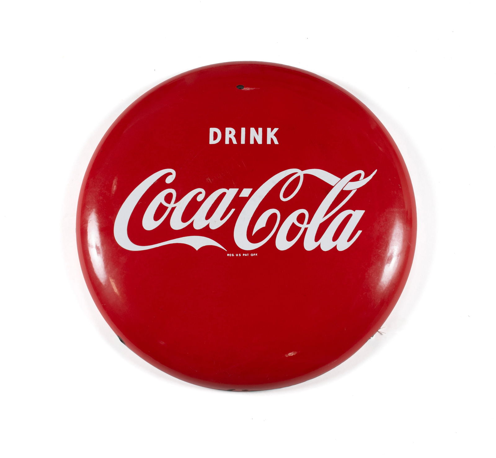 DRINK COCA-COLA ENAMELED BUTTON SIGN: DRINK COCA-COLA ENAMELED BUTTON SIGN American, 20th century. Red porcelain covered advertising sign with white lettering. 24 in. (61 cm.)