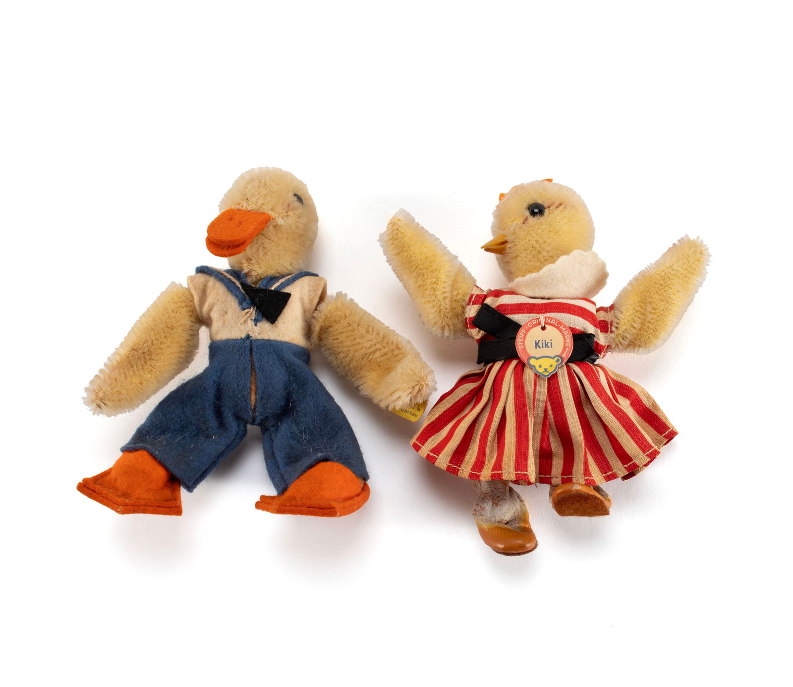 STEIFF 'KIKI' HEN AND 'QUAGGI' DUCK: STEIFF 'KIKI' HEN AND 'QUAGGI' DUCKGerman, 20th century, two (2) pieces. Kiki with original circular Steiff paper tag, and Quaggi with yellow tag held by button.5 in. (12.7 cm.)