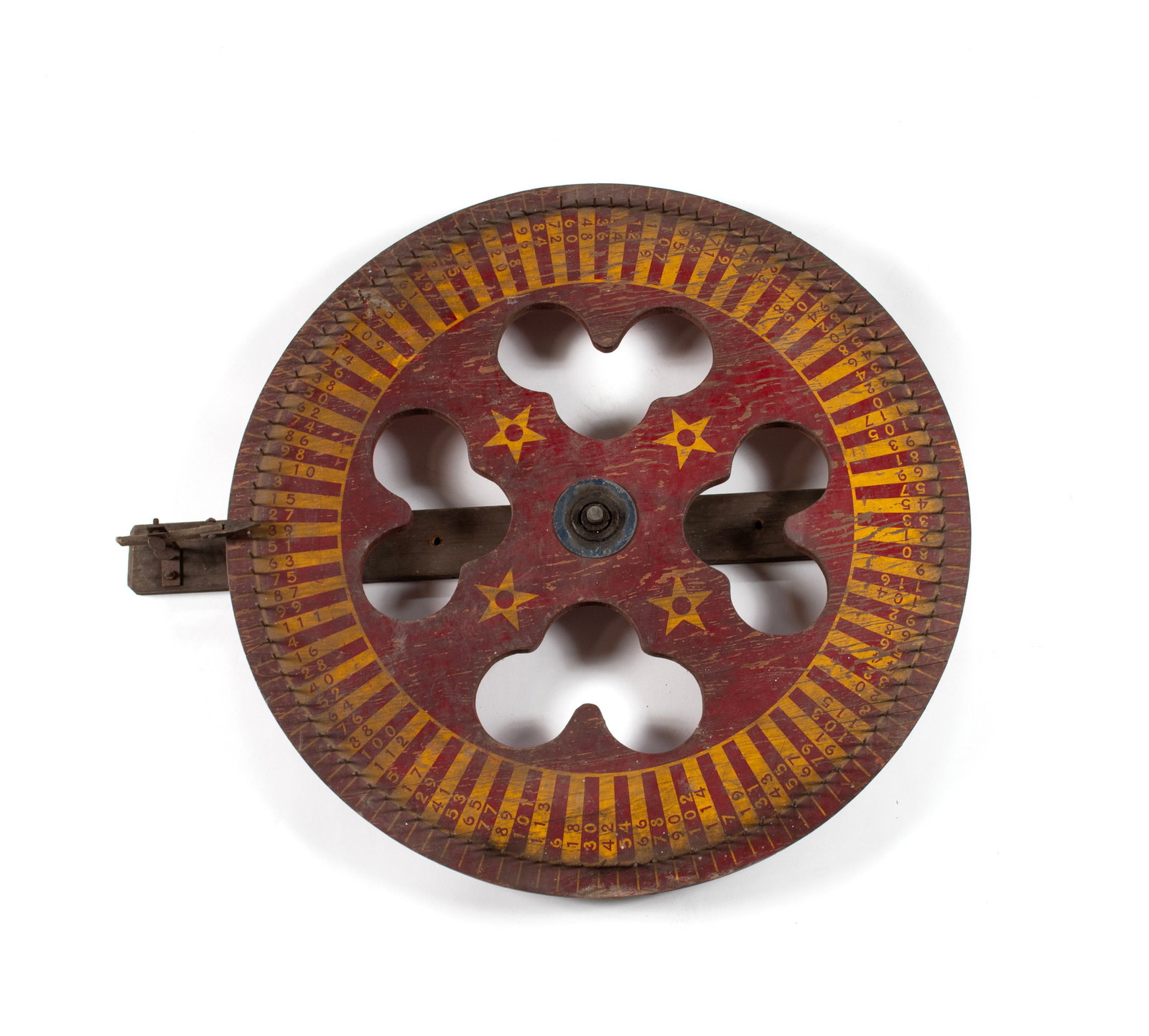 CARNIVAL GAMBLING ROULETTE WHEEL: CARNIVAL GAMBLING ROULETTE WHEEL20th century. Pierced to the center of the red and yellow.29 x 34 in. (73.7 x 86.4 cm.)