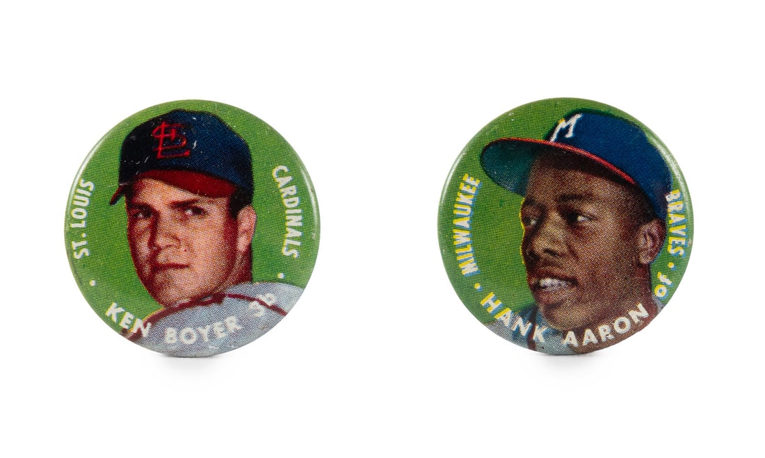 KEN BOYER AND HANK AARON 1956 TOPPS BASEBALL PINS: KEN BOYER AND HANK AARON 1956 TOPPS BASEBALL PINSIncluding a Ken Boyer St. Louis Cardinals pin, and a Hank Aaron Milwaukee Braves pin.Diameter 1.19 in. (3 cm.)