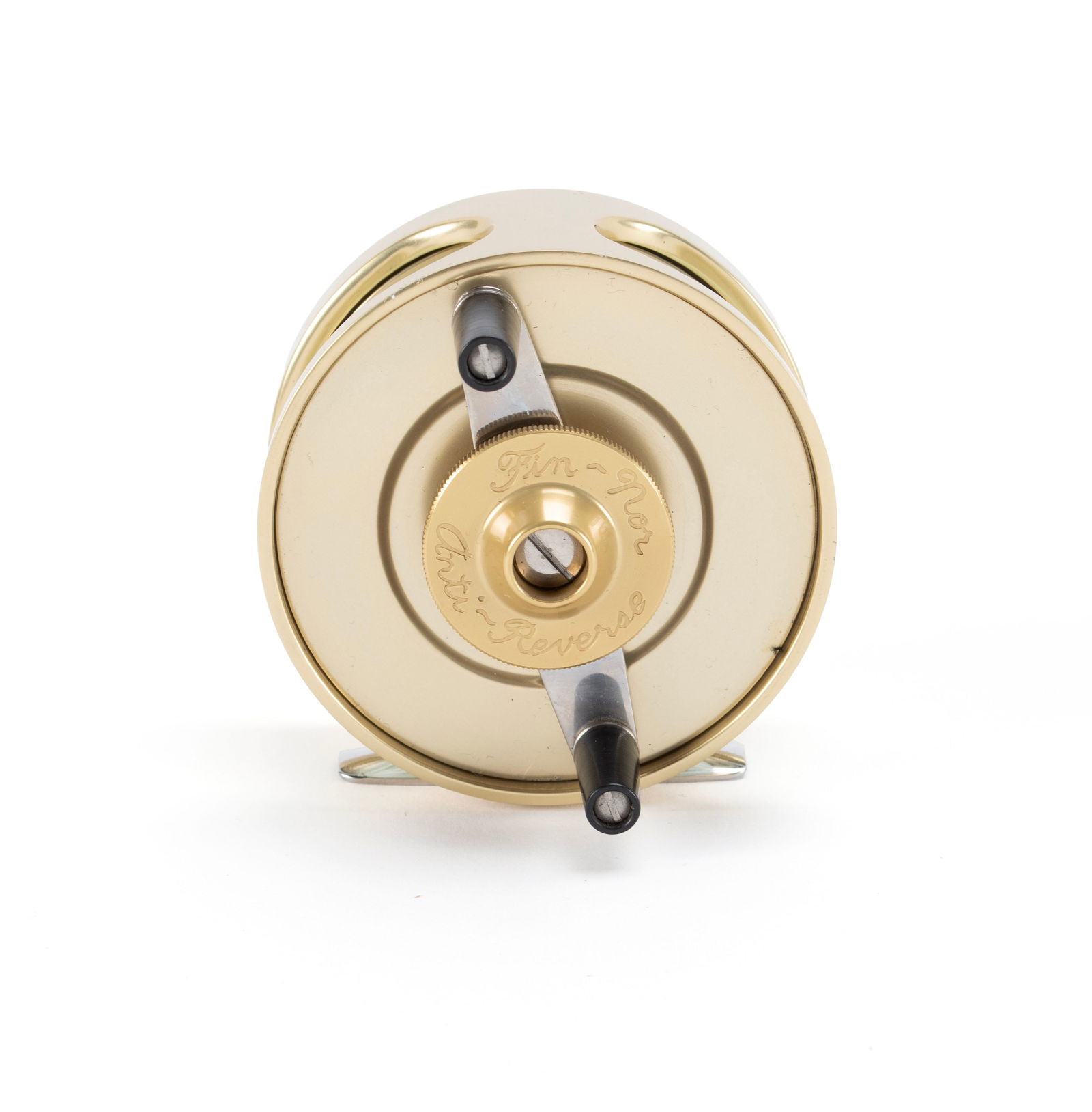 FIN NOR FLY REEL: FIN NOR FLY REELAmerican, marked "2" next to the rod mount plate and 'anti-reverse' with the name, gold finish.Diameter: 3 1/4 in. (8.3 cm.)