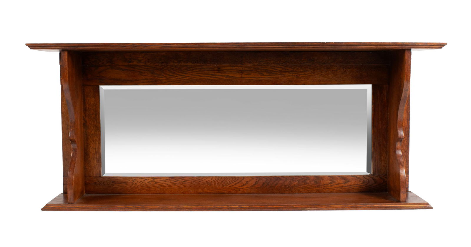 OAK WALL MOUNT MIRROR: American, early 20th century. Display shelf above and below the rectangular beveled mirror panel.22 1/2 x 55 x 9 in. (57.2 x 139.7 x 22.9 cm.)