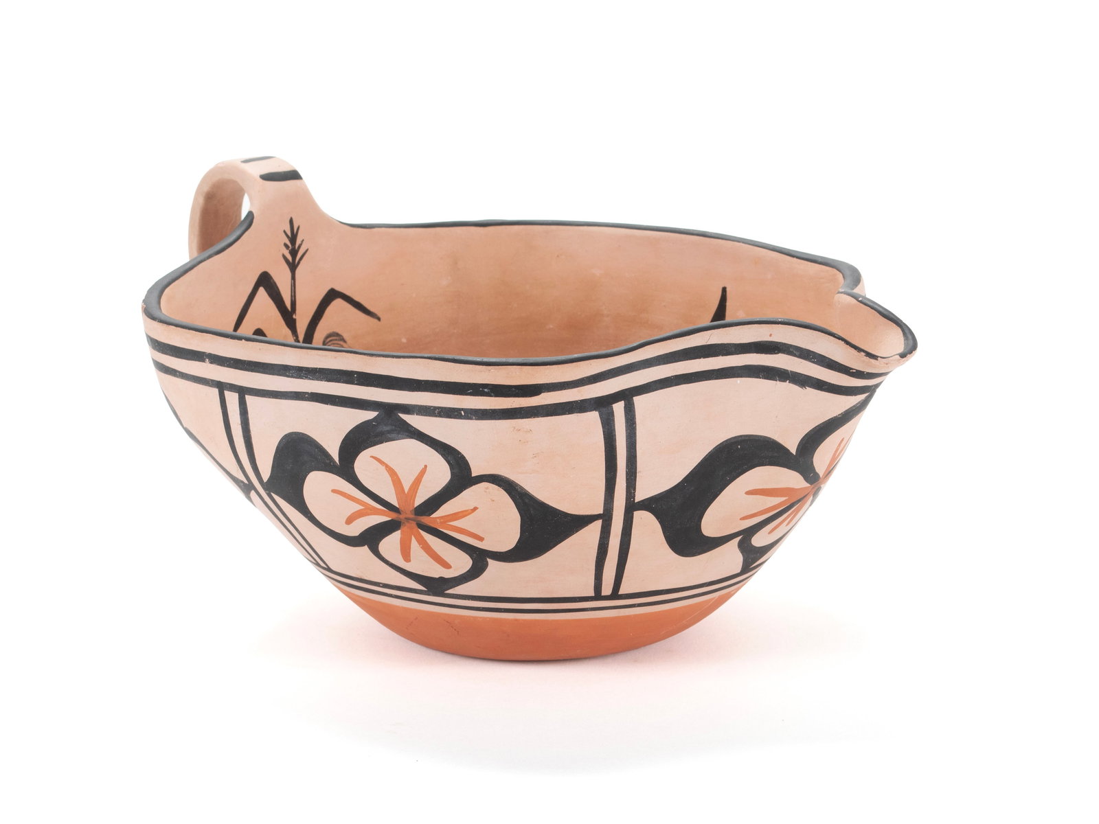 PUEBLO POTTERY PITCHER: PUEBLO POTTERY PITCHER 20th century. Santo Domingo pottery pitcher with floral and cornstalk decoration. 6 x 12 in. (15.2 x 30.5 cm.)