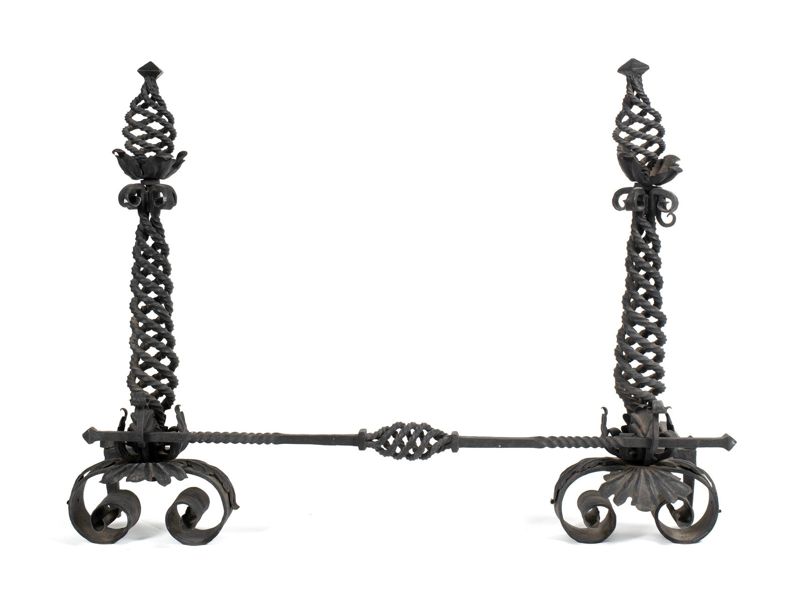 PAIR OF ARTS AND CRAFTS ANDIRONS: PAIR OF ARTS AND CRAFTS ANDIRONS American, cast iron. Pair of andirons with spiraling highlights, and matching front fender/bar. Each andiron: 34 x 30 x 11 in. (86.4 x 76.2 x 27.9 cm.), Bar: 45 in.