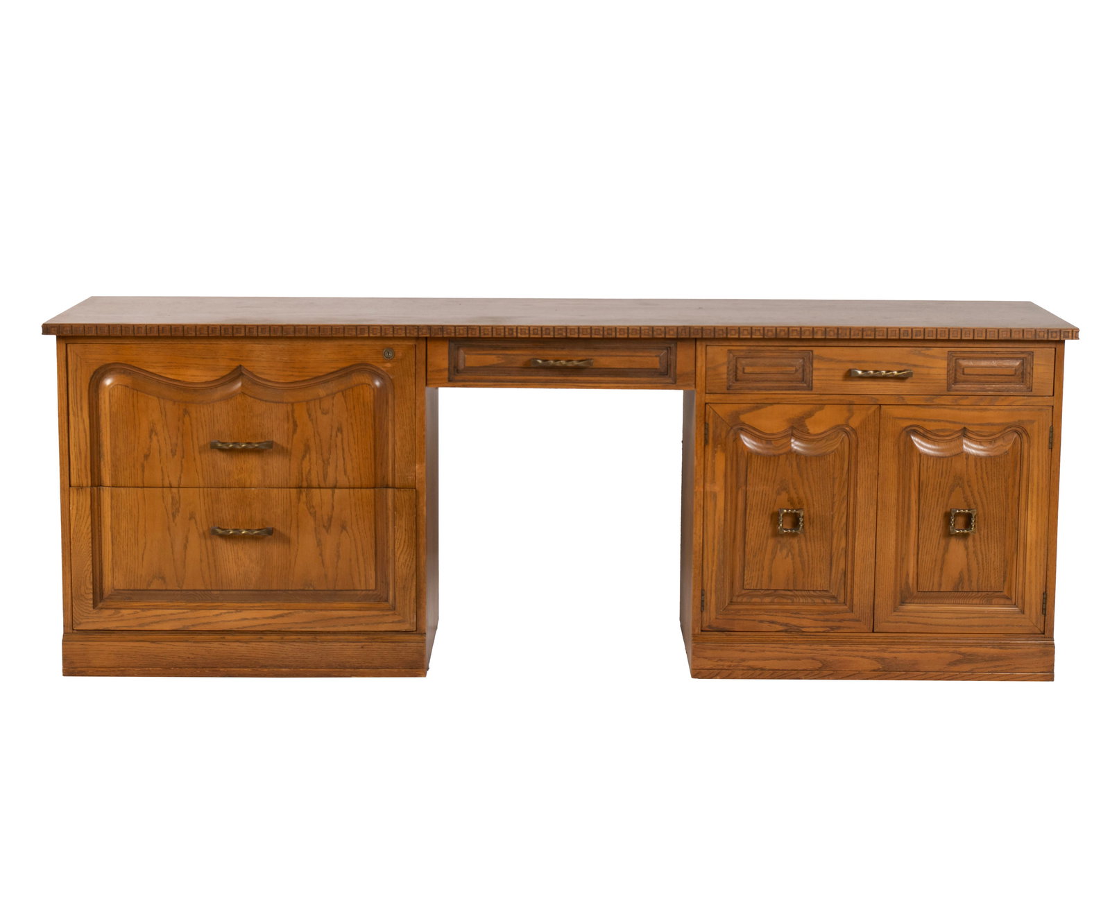 ROMWEBER VIKING OAK EXECUTIVE DESK: ROMWEBER VIKING OAK EXECUTIVE DESK American, 3rd quarter 20th century. Long rectangular surface with central frieze drawer over the kneehole opening, flanked by drawers to one side and panel doors to
