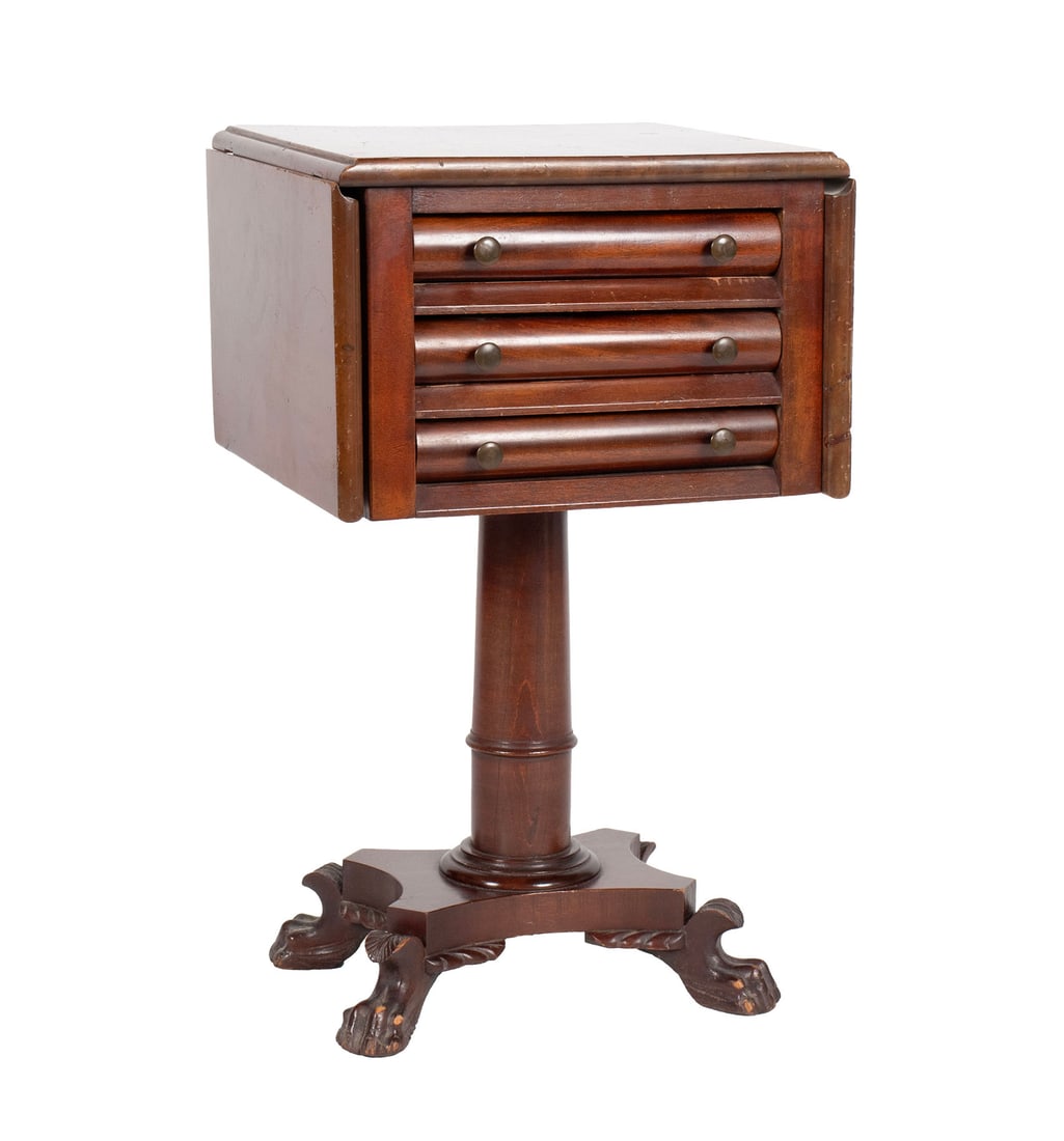 EMPIRE SEWING TABLE: EMPIRE SEWING TABLE American, 19th century. Drop leaf top with three short drawers, on pedestal support with animal form feet. Leaves down: 28 1/2 x 17 x 16 in. (72.4 x 43.2 x 40.6 cm.), Leaves out: