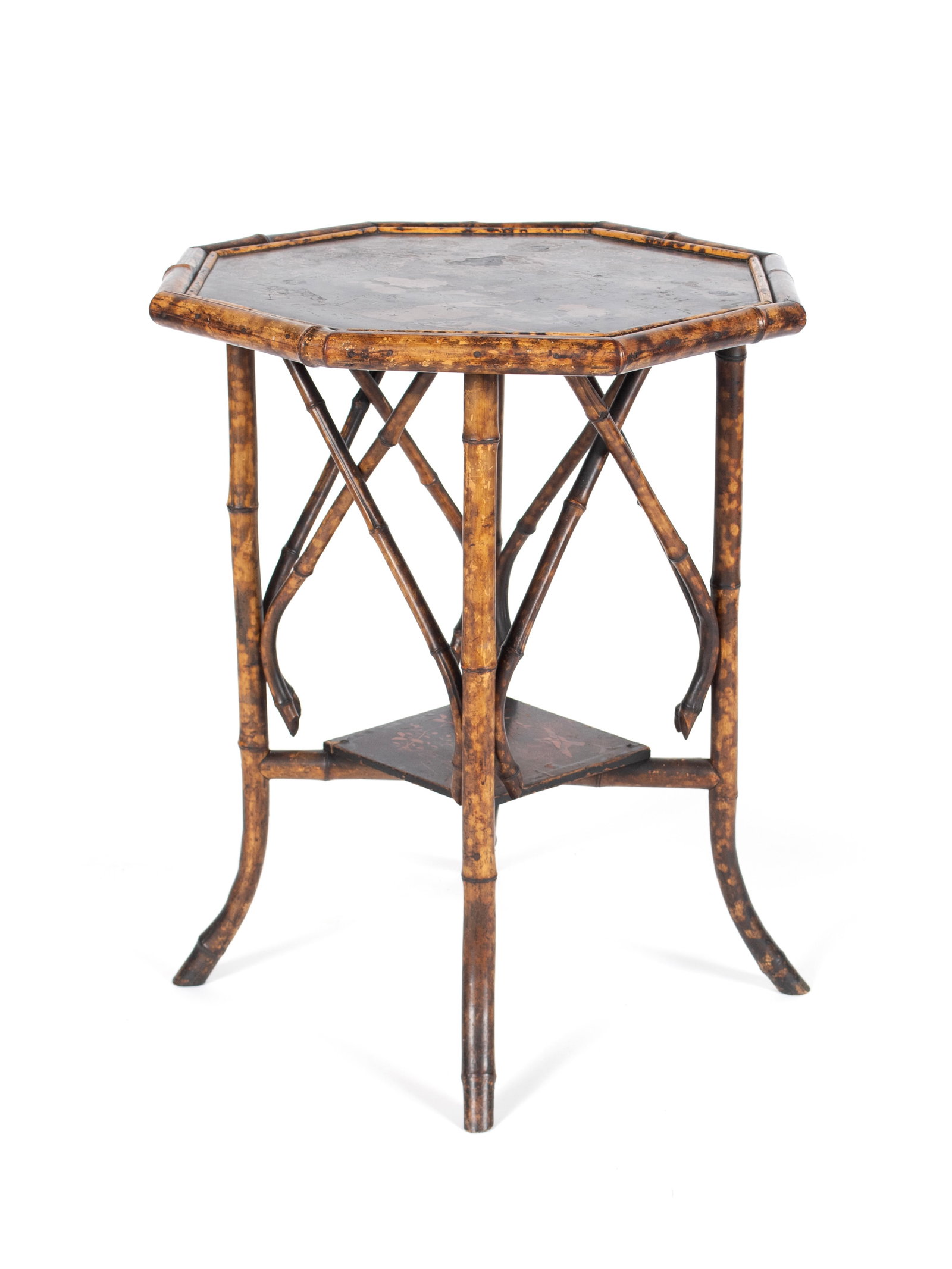 JAPANNED FAUX BAMBOO CENTER TABLE: JAPANNED FAUX BAMBOO CENTER TABLE English, early 20th century. Octagonal form, the black lacquered top decorated with a floral filled landscape with birds, with matching medial shelf/stretcher below