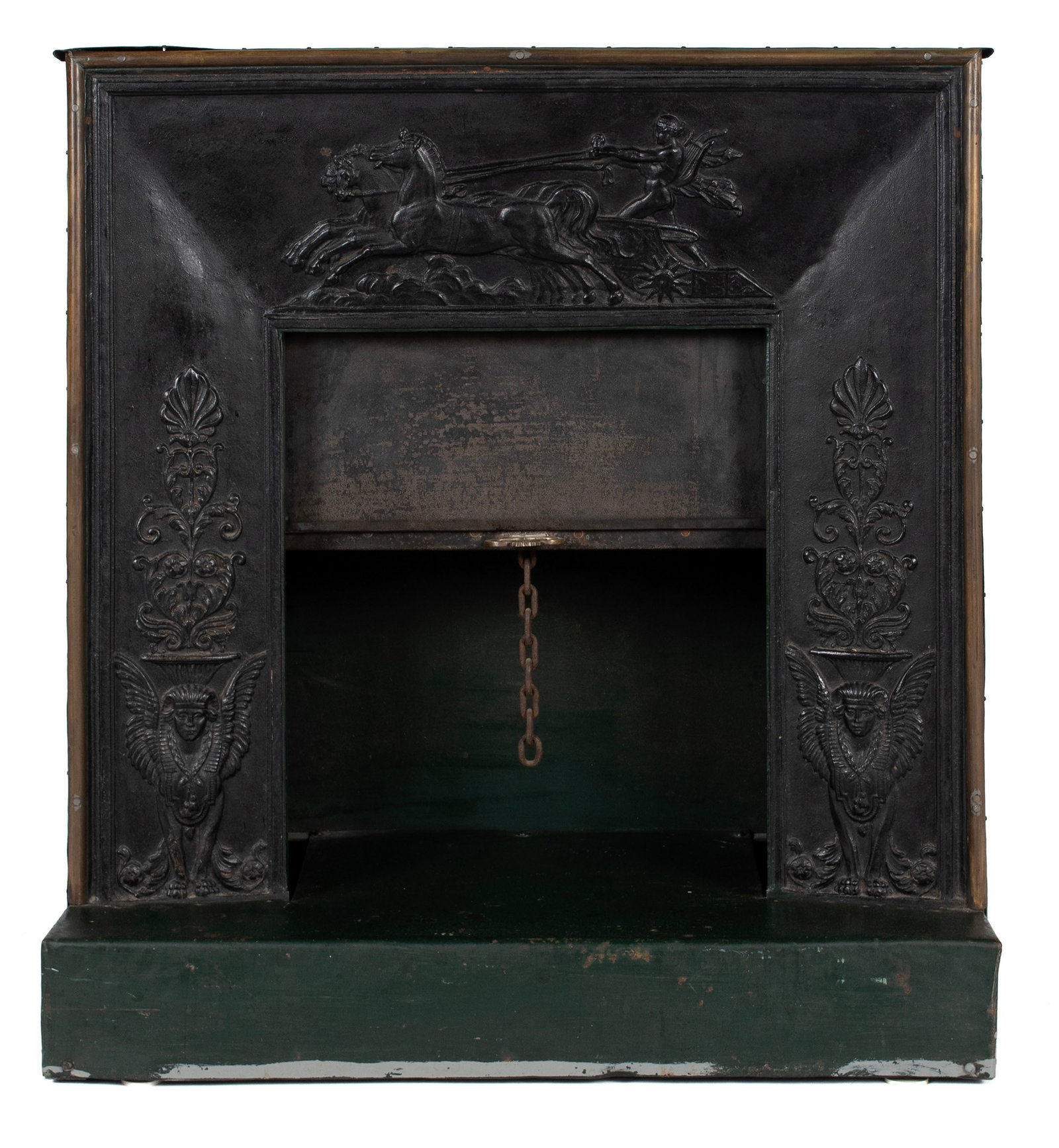 EMPIRE FIREPLACE: EMPIRE FIREPLACE Continental, 19th century, altered. Arched iron front panel cast with winged griffins to both sides and a horse drawn chariot across the top, with a pull-down half-door working on