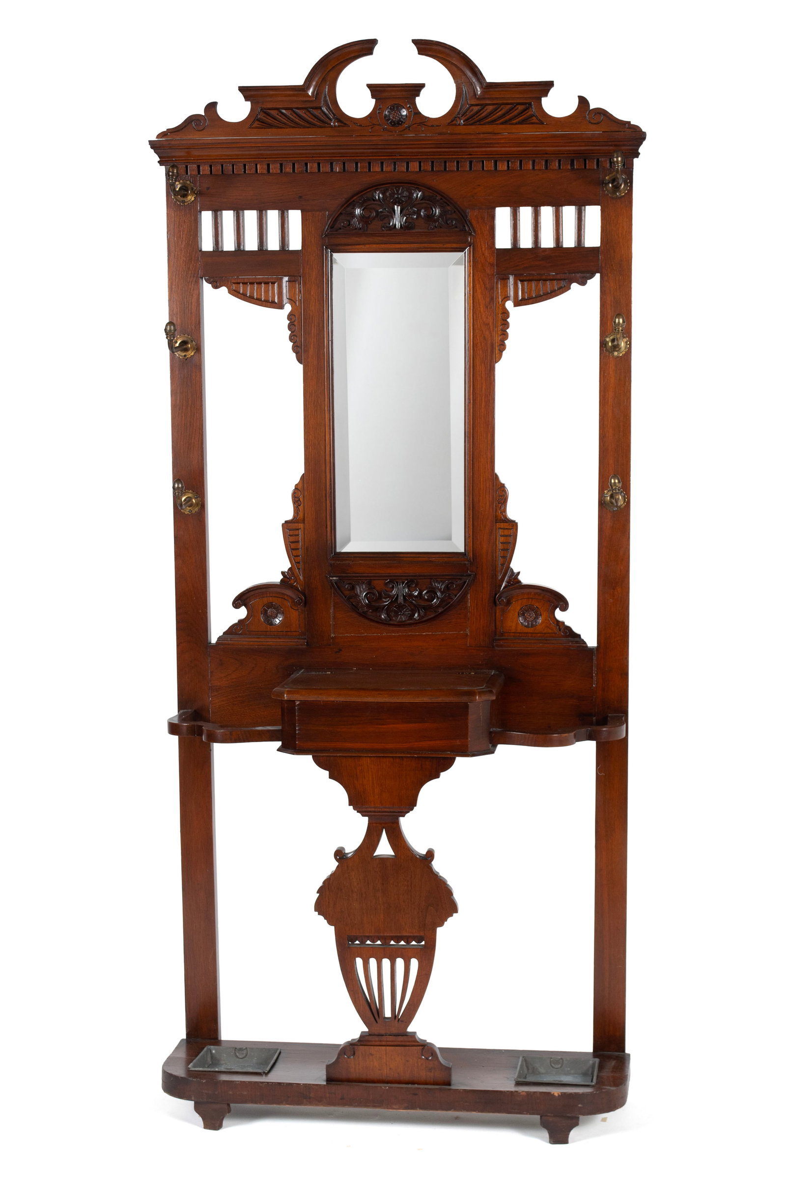 VICTORIAN STYLE HALL TREE: VICTORIAN STYLE HALL TREE English, early 20th century. Rectangular form with open arched crest, slender mirror below flanked by side stile with hat hooks with a central hinged compartment flanked by