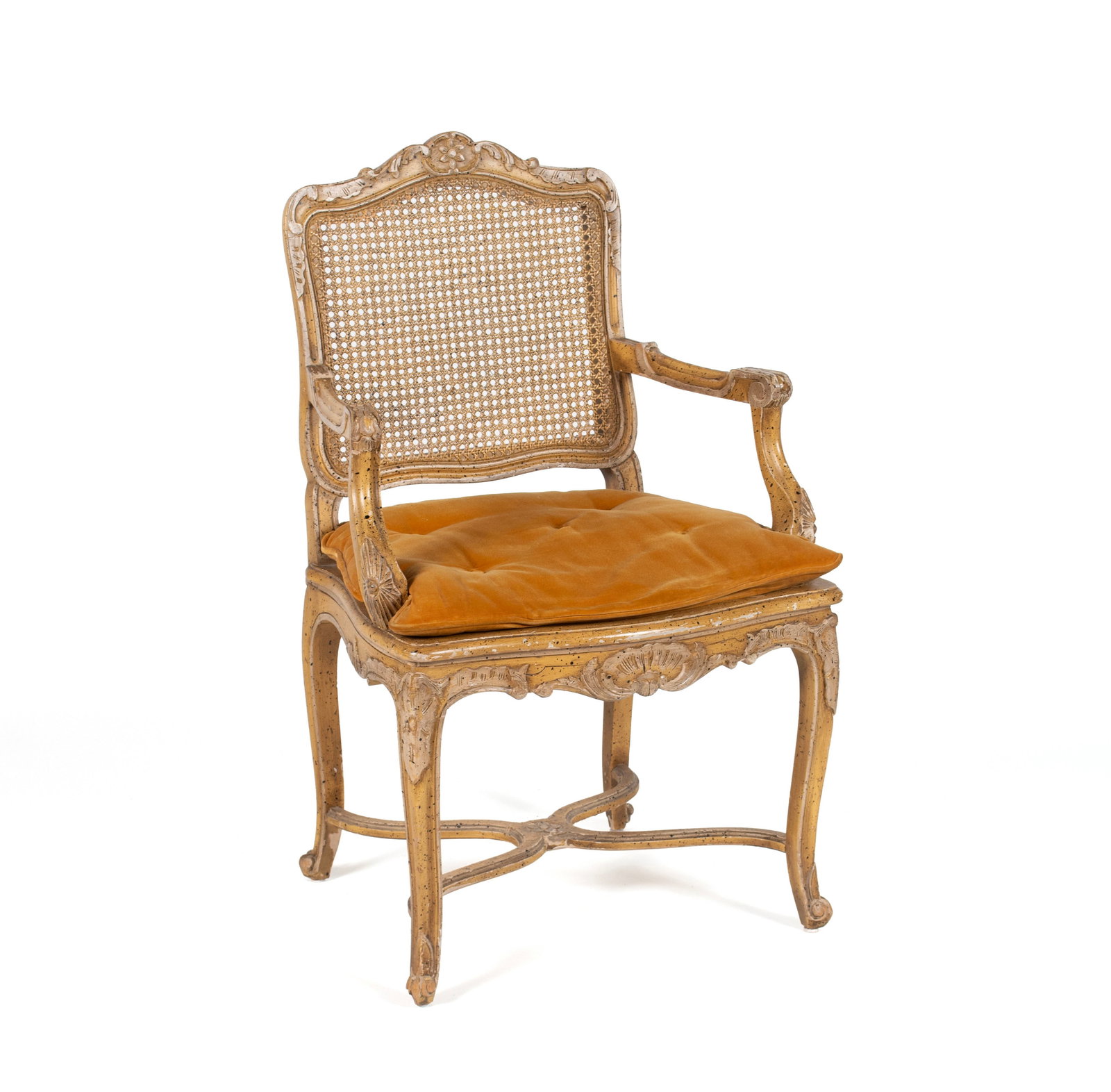 LOUIS XV STYLE ARMCHAIR: LOUIS XV STYLE ARMCHAIR 20th century. Armchair with caned back and seat, distressed surface. 38 x 23 x 19 in. (96.5 x 58.4 x 48.3 cm.)