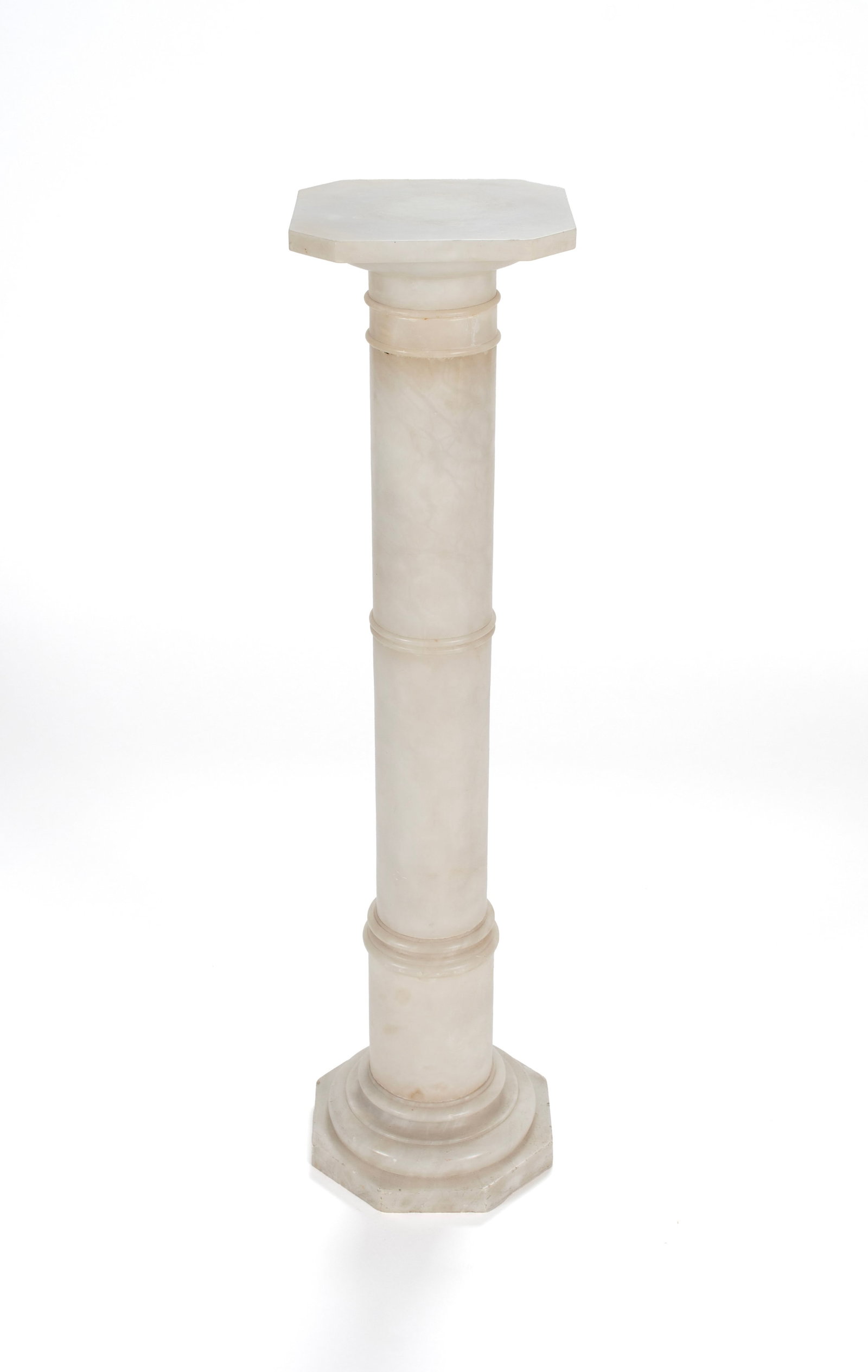 WHITE MARBLE PEDESTAL: WHITE MARBLE PEDESTAL 20th century. Marble columnar pedestal with octagonal top and base. 41 x 9 1/2 x 9 1/2 in. (104.1 x 24.1 x 24.1 cm.)