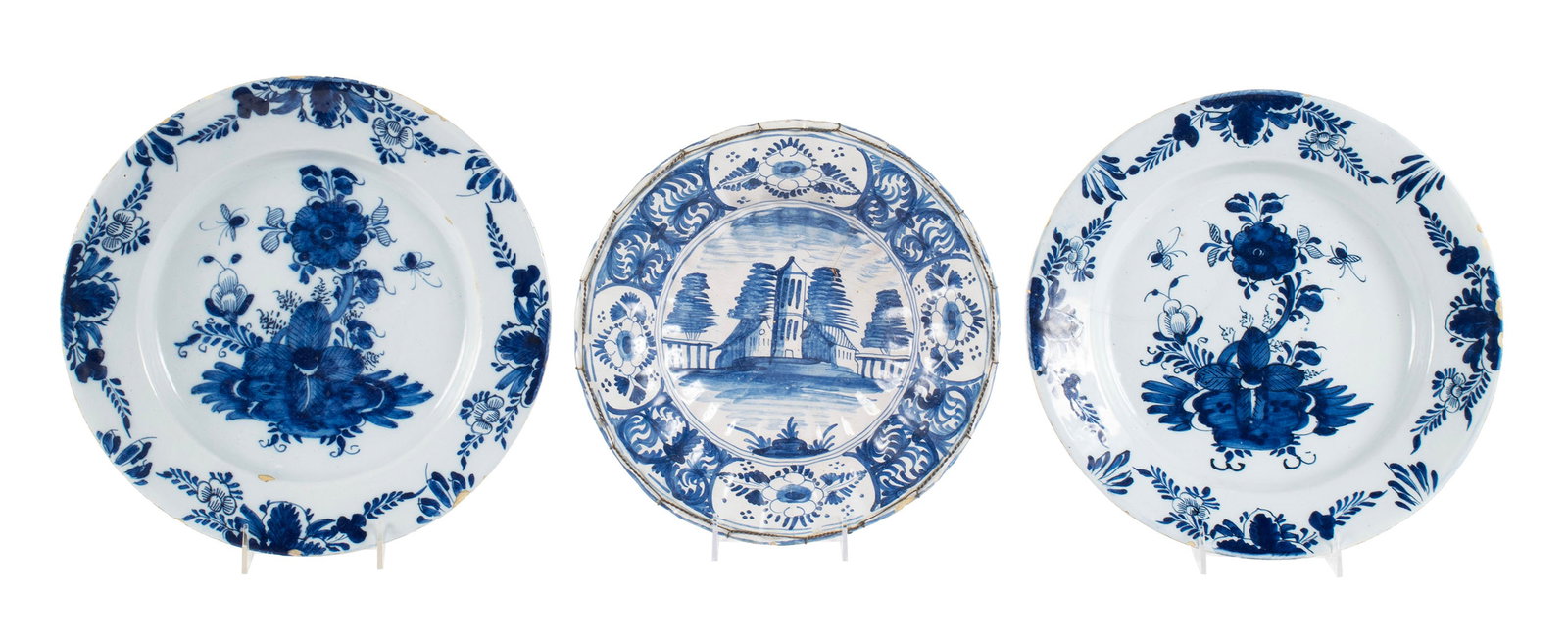 THREE PIECES OF DELFTWARE: THREE PIECES OF DELFTWARE 19th century. Including a pair of chargers and a bowl. Chargers: 13 1/2 in. (34.3 cm.)