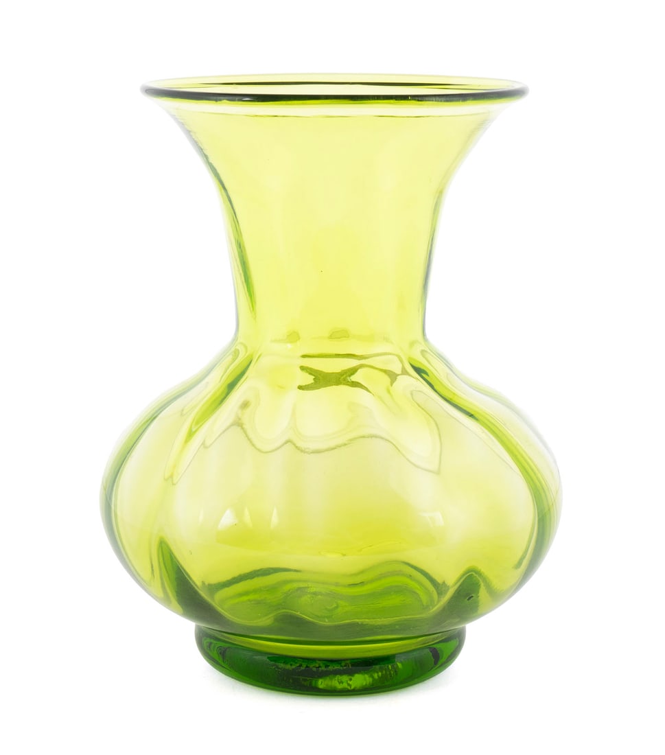 BLENKO GREEN GLASS VASE: BLENKO GREEN GLASS VASE American, mid-20th century, bears the "Blenko Handcraft" sticker on shoulder. Green with ribbed body and flaring upper rim. 6 1/2 in. (16.5 cm.)