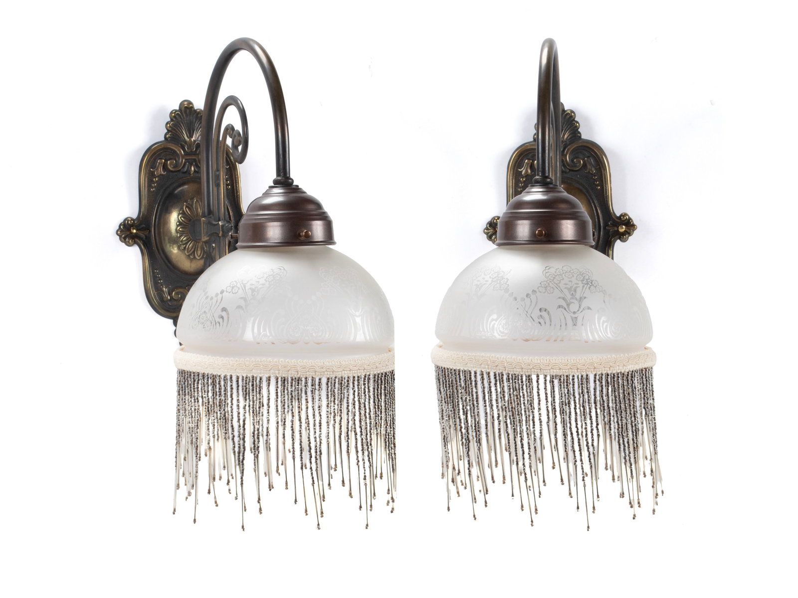 PAIR OF WALL SCONCES: PAIR OF WALL SCONCES American, 3rd quarter 20th century, brass. Scrolling decorative supports mounted to the wall plates, holding the etch decorated domical shades with dangling beads. Each: 10 x 11 1