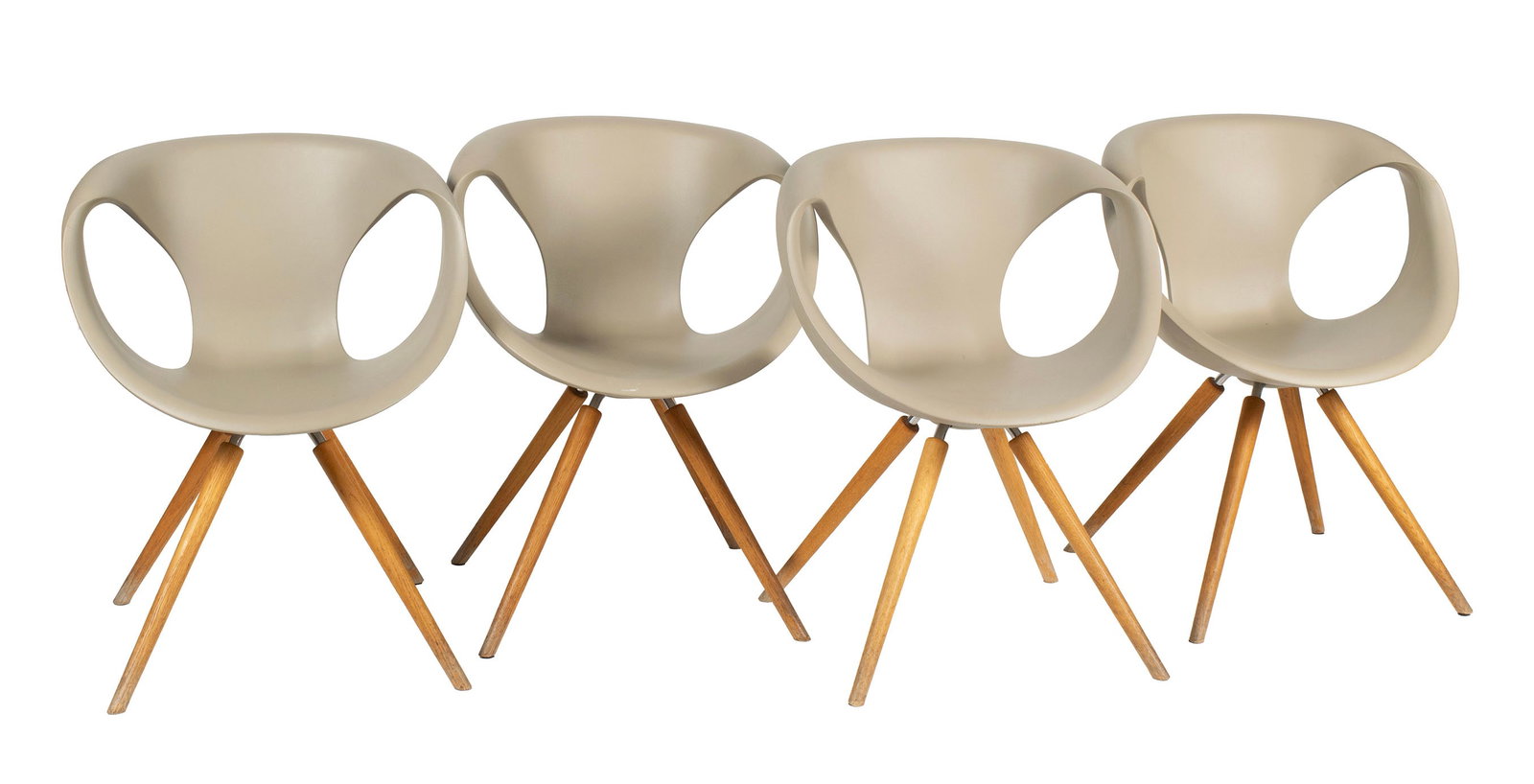 FOUR 'UP' CHAIRS BY TONON: FOUR 'UP' CHAIRS BY TONON Italian, designed by Martin Ballendat. Four (4) chairs with tan polyurethane shells on wooden legs, marked under seat. Each: 32 1/4 x 24 in. (81.9 x 61 cm.) Collection of