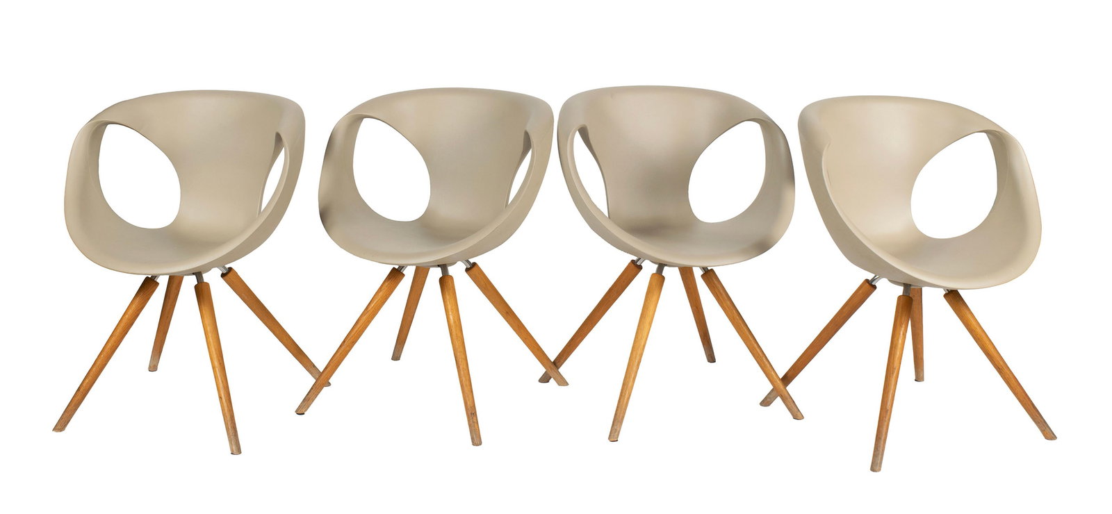 FOUR 'UP' CHAIRS BY TONON: FOUR 'UP' CHAIRS BY TONON Italian, designed by Martin Ballendat. Four (4) chairs with tan polyurethane shells on wooden legs, marked under seat. Each: 32 1/4 x 24 in. (81.9 x 61 cm.) Collection of