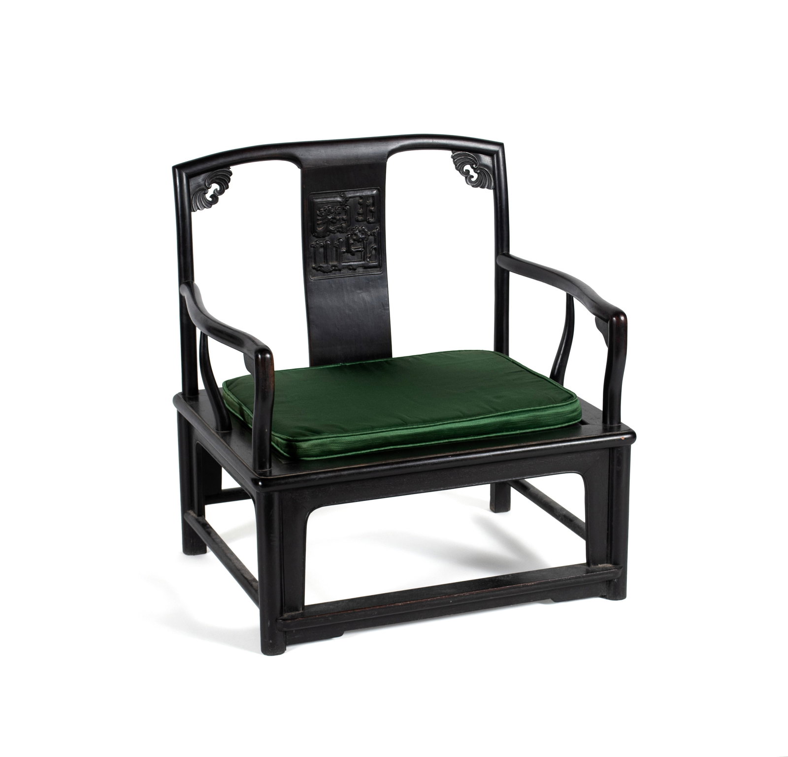 MING STYLE ARMCHAIR: MING STYLE ARMCHAIR 20th century. Dark stained wood low armchair with carved highlights. 31 x 22 x 28 in. (78.7 x 55.9 x 71.1 cm.)