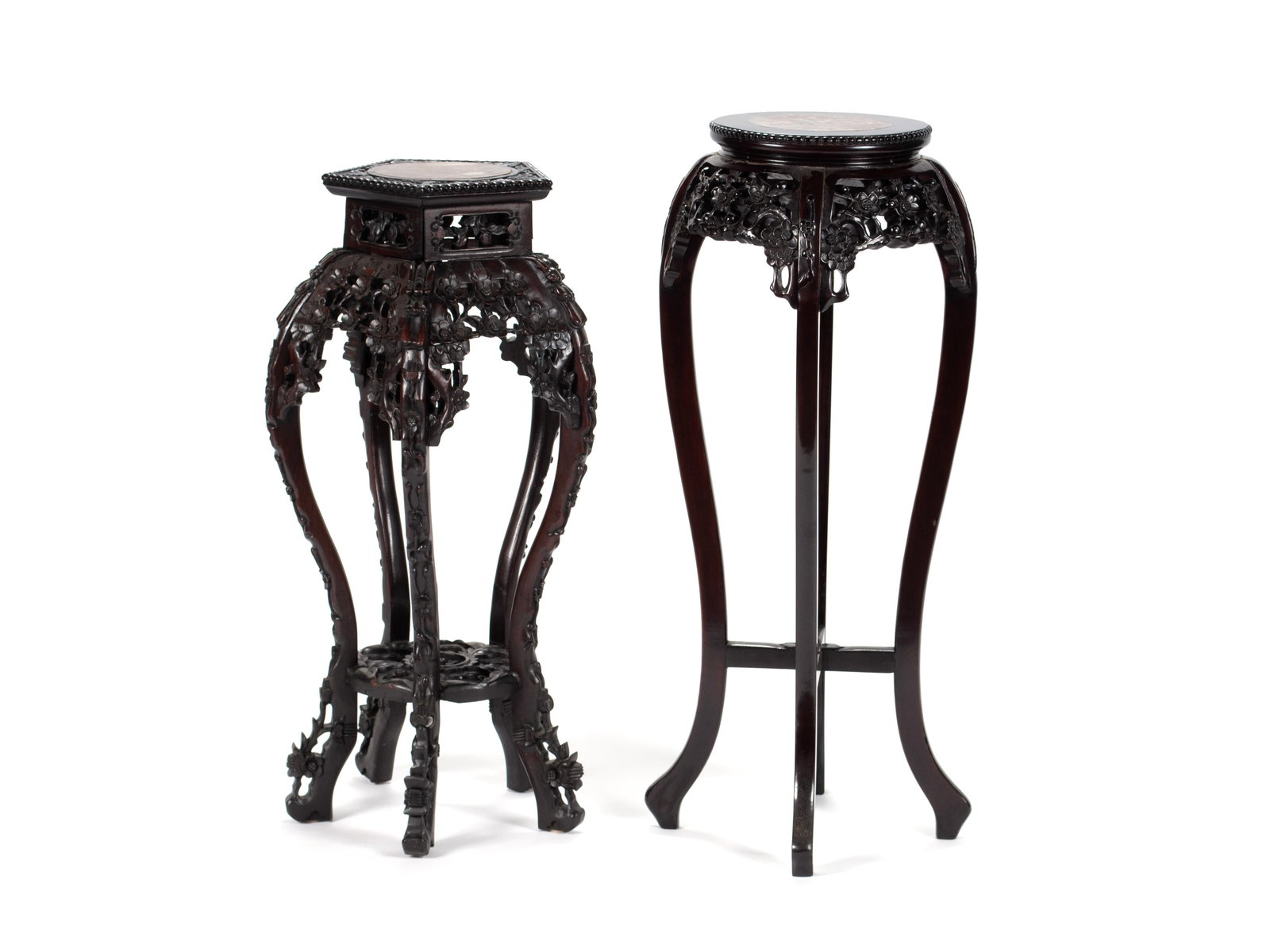TWO CHINESE FERN STANDS: TWO CHINESE FERN STANDS Chinese, 20th century. Including a taller circular example and a hexagonal example, both with carved decoration and inset marble tops. Taller: 35 x 15 x 15 in. (88.9 x 38.1 x